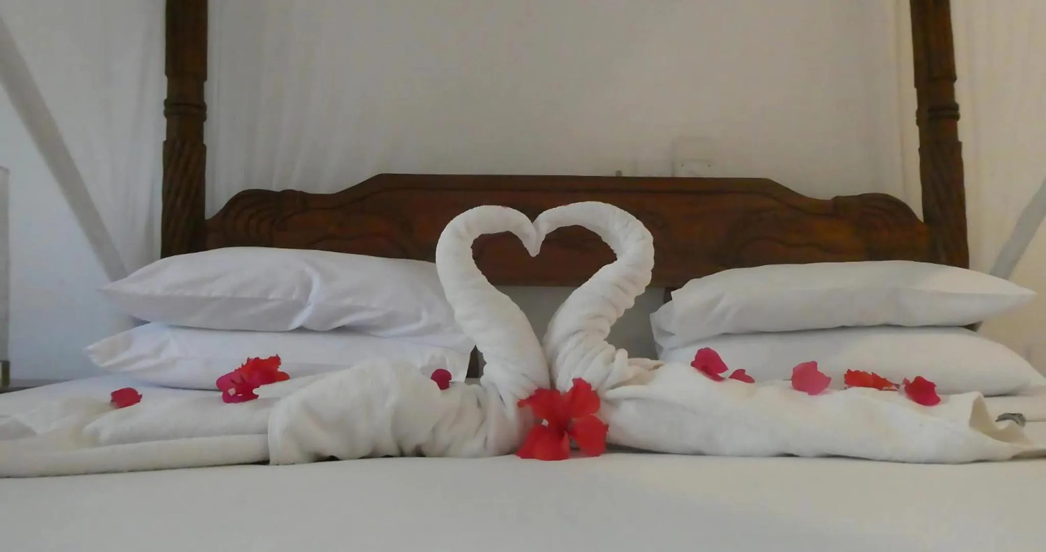 Bed in Lily Palm Resort