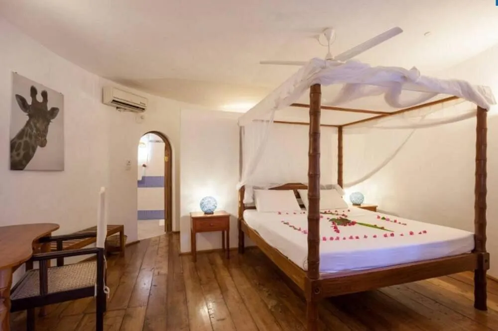 Bed in Lily Palm Resort