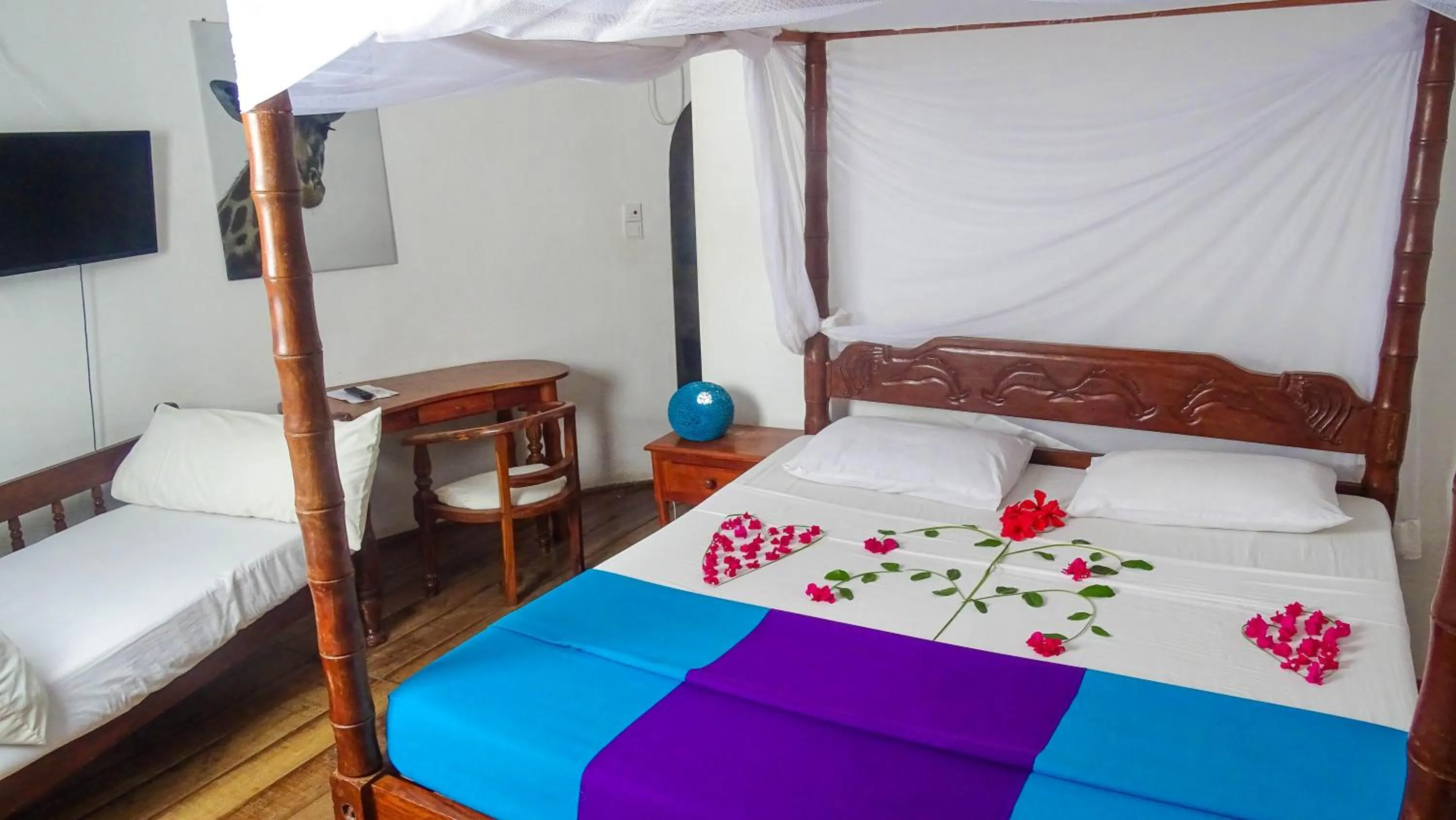 Bed in Lily Palm Resort