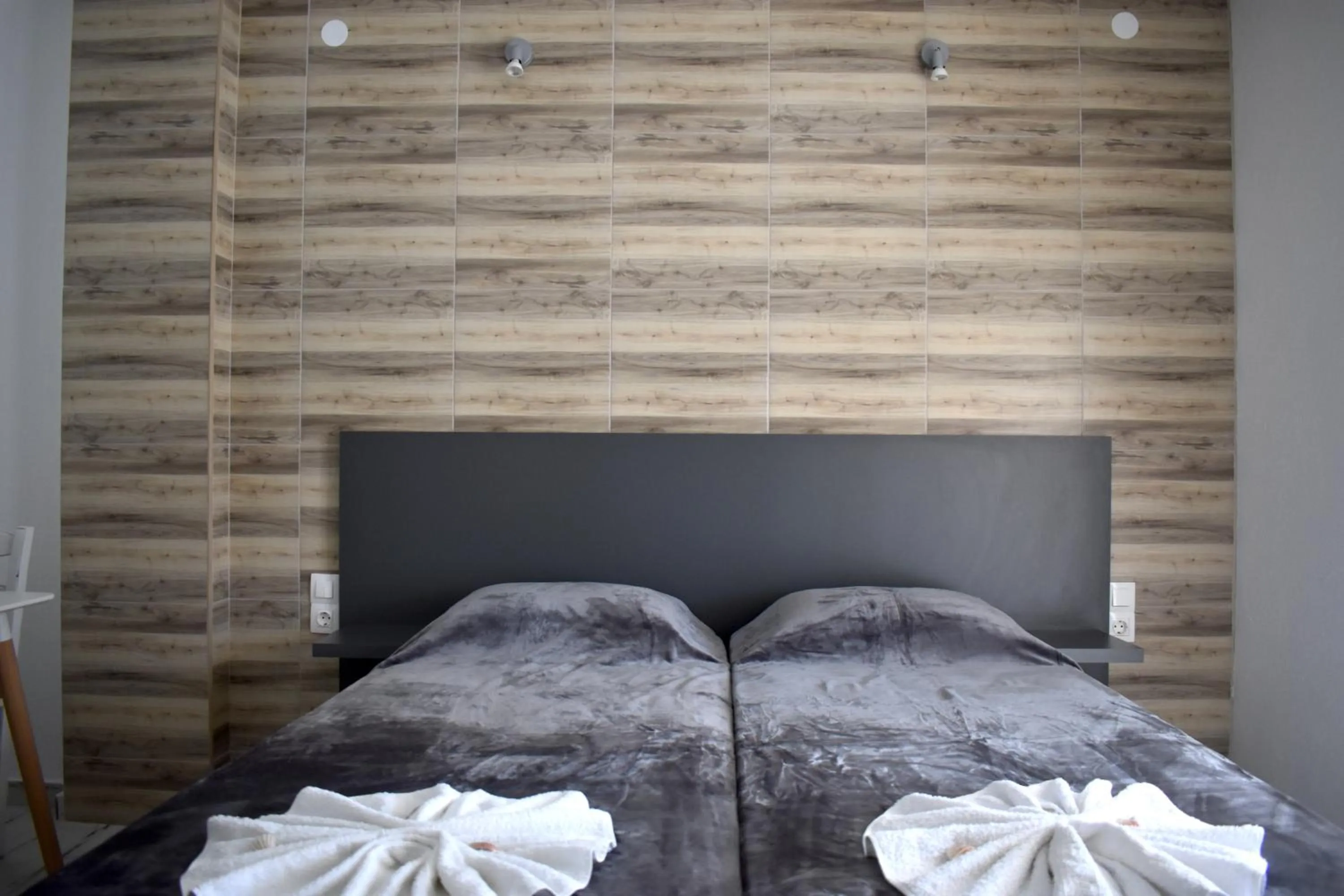 Bed in Polykratis Rooms