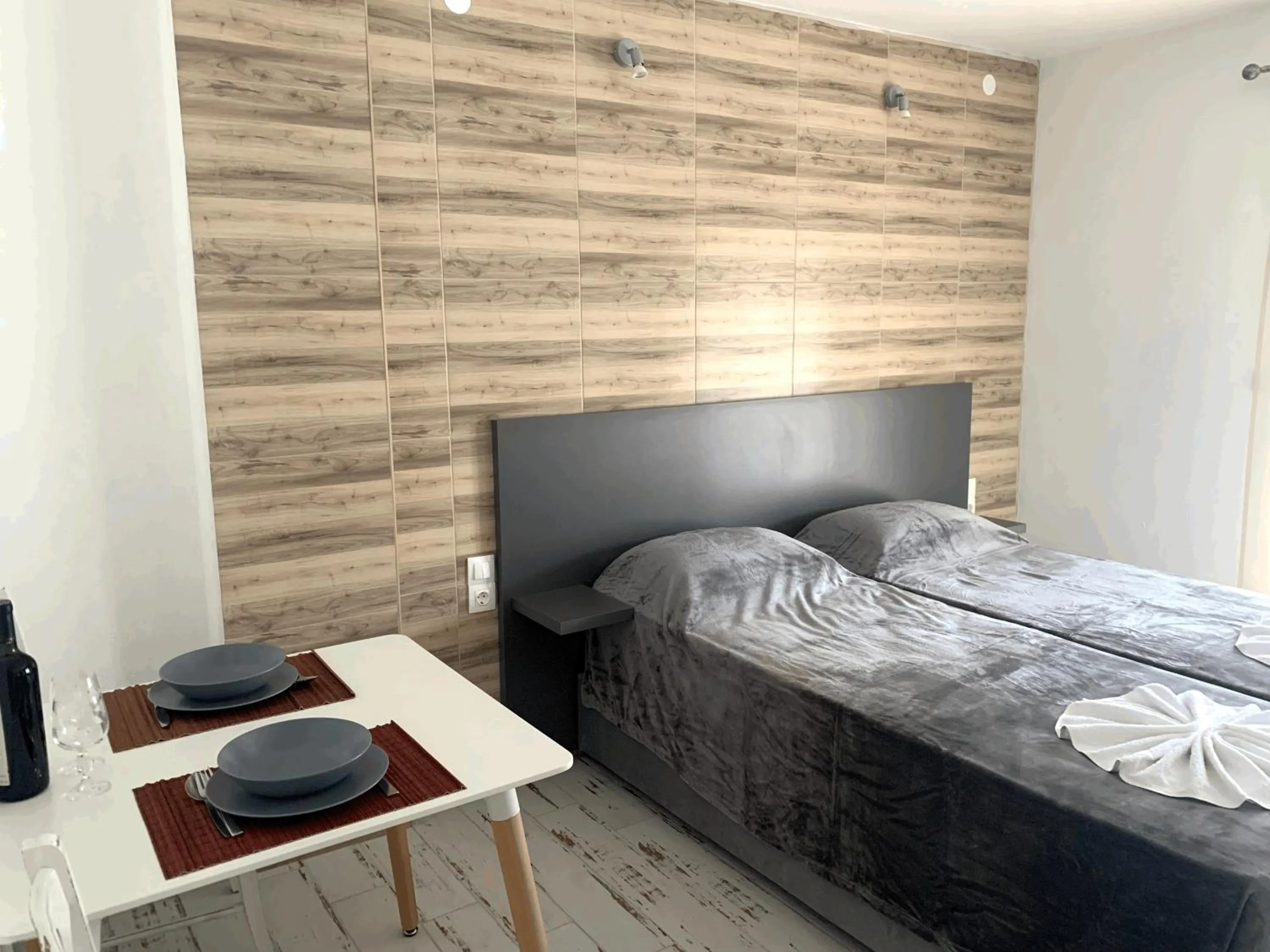 Bed in Polykratis Rooms