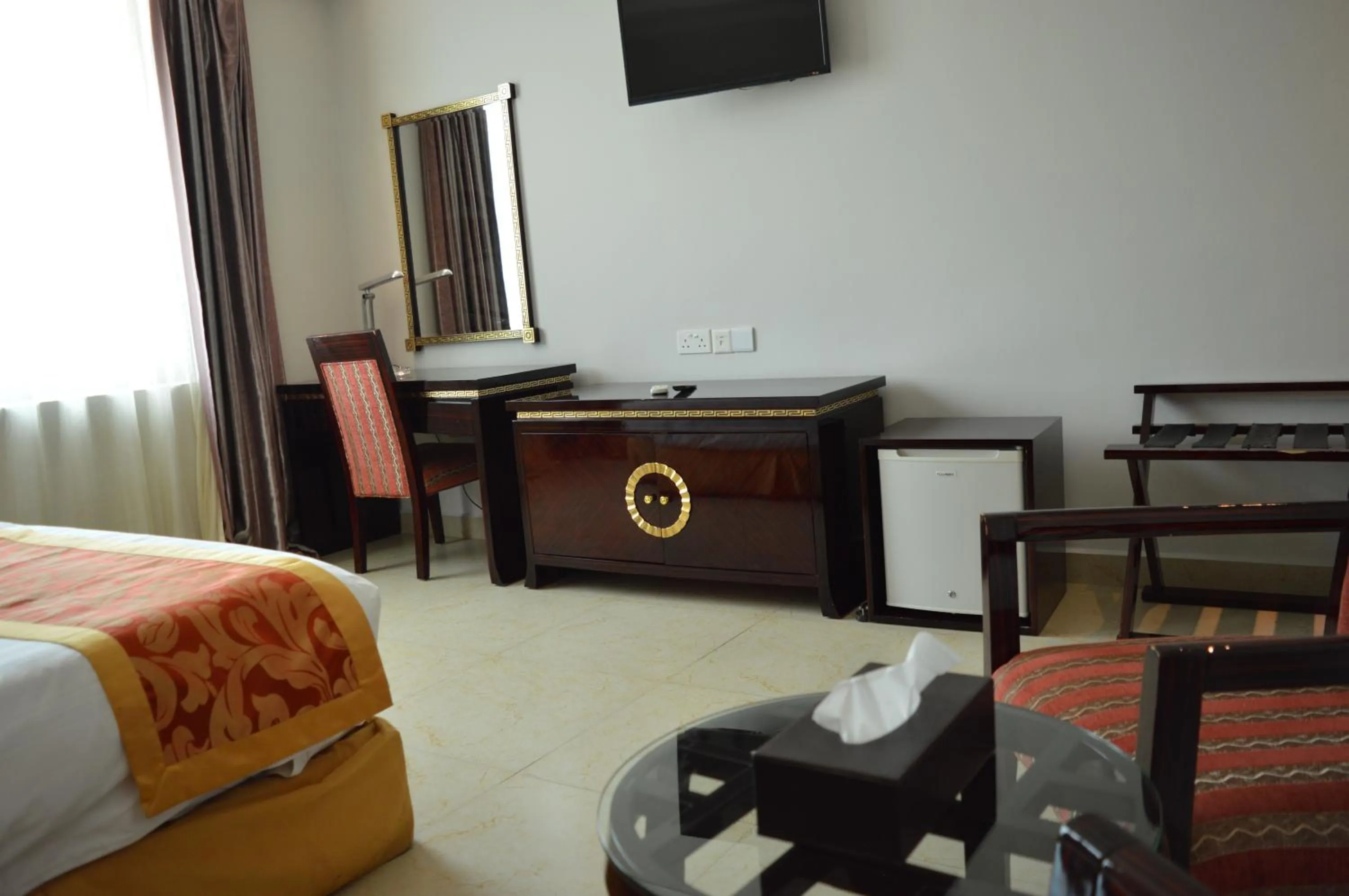 Living room, Bed in Tiffany Diamond Hotels - Mtwara
