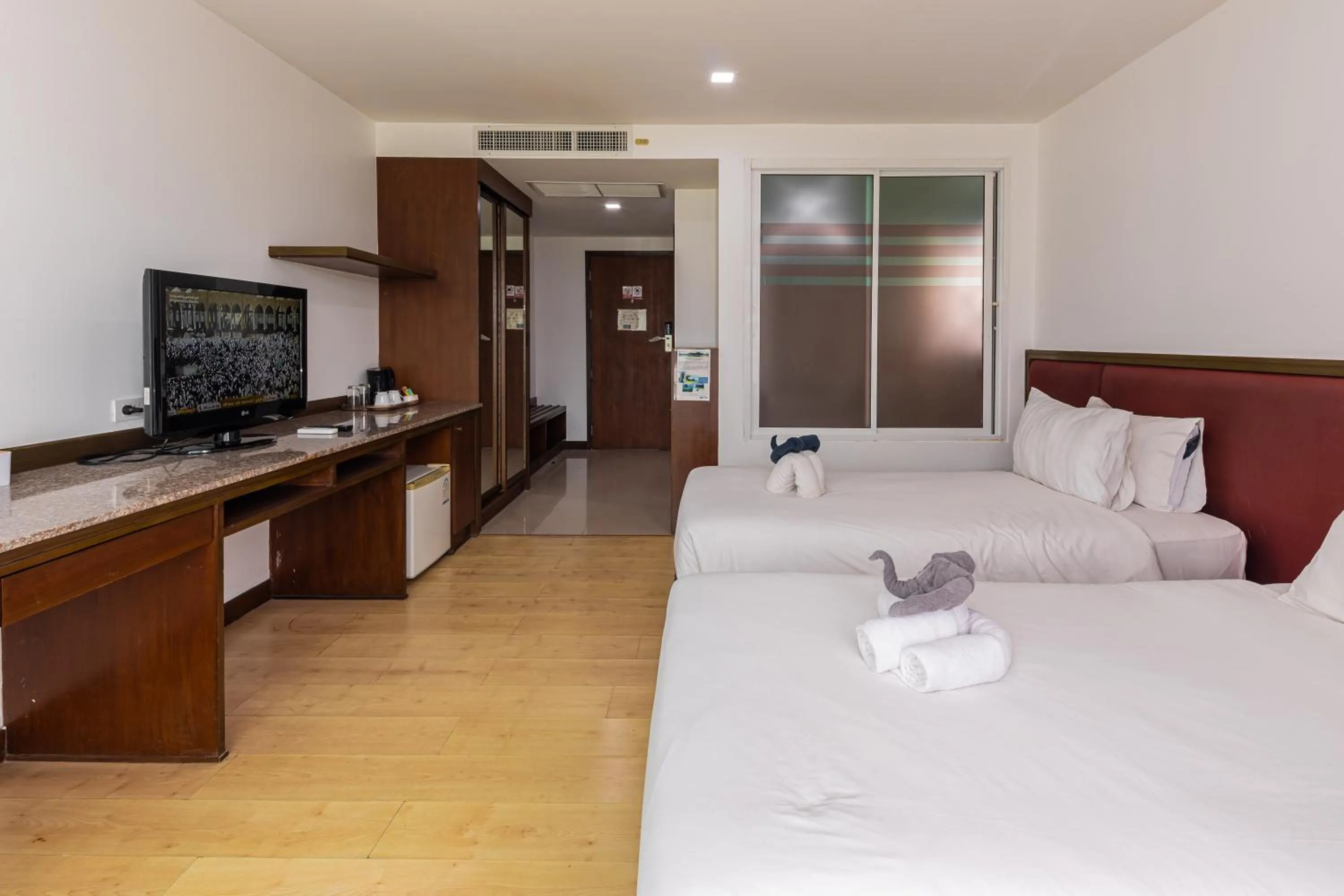 Bed in The Kris Resort Hotel