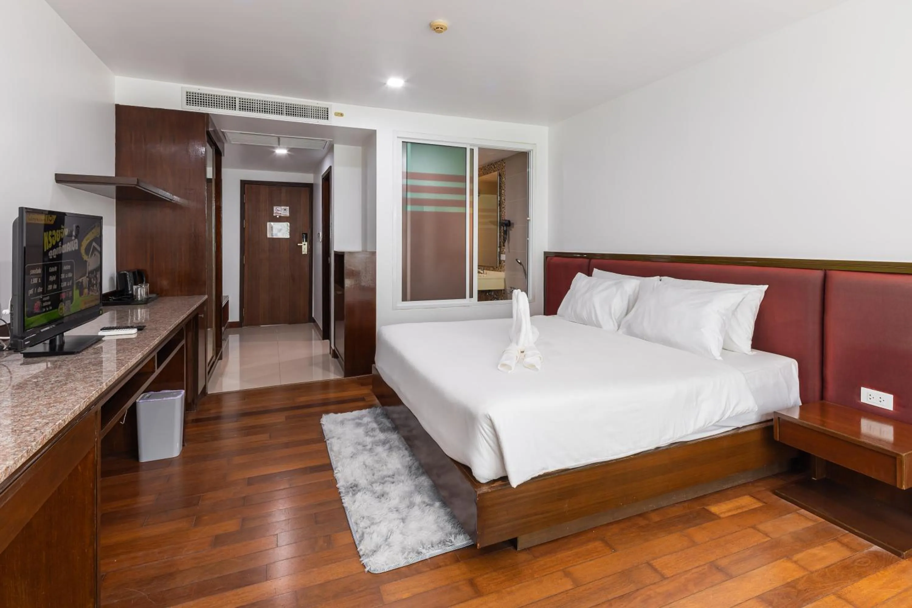 Bed in The Kris Resort Hotel