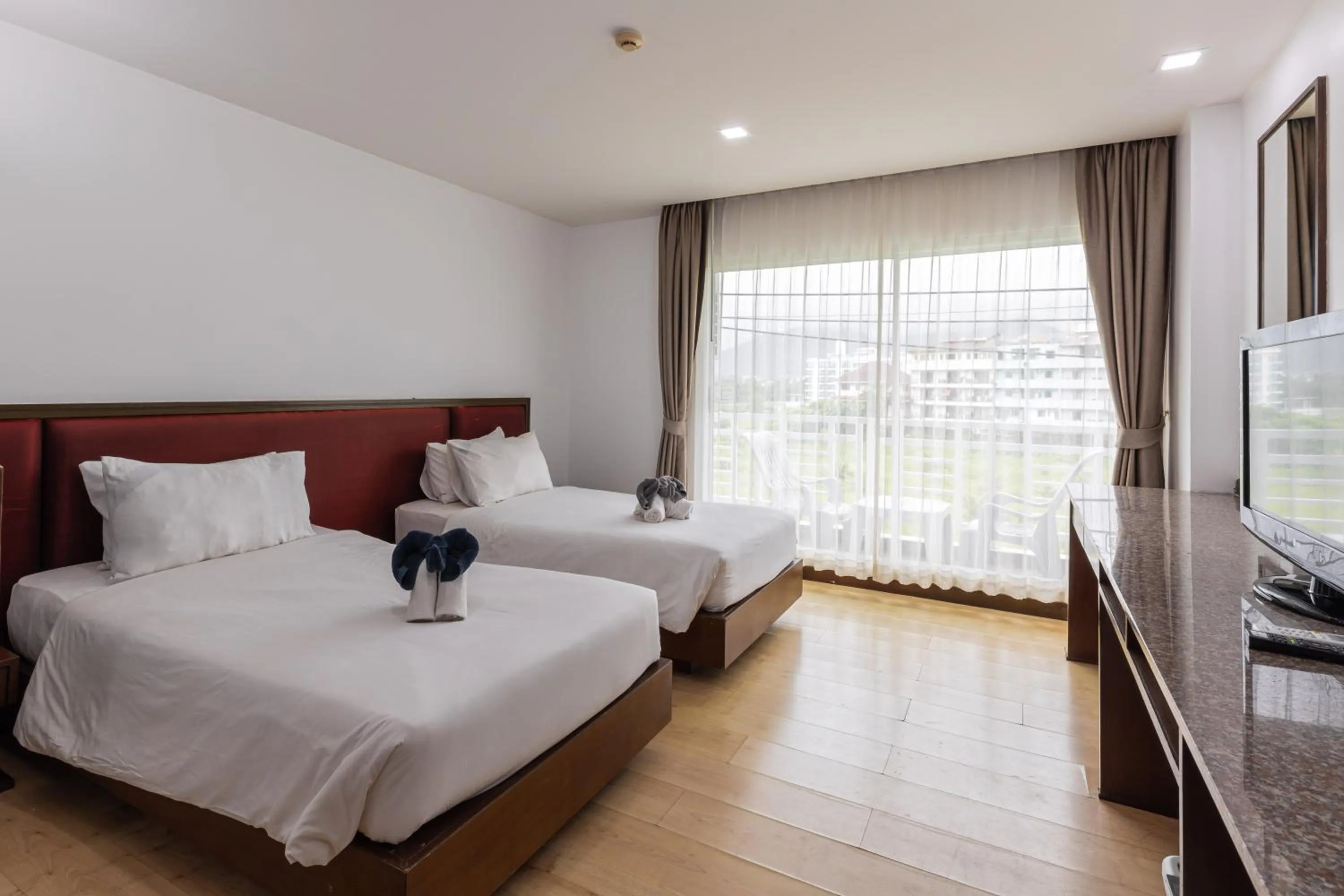 Bed in The Kris Resort Hotel