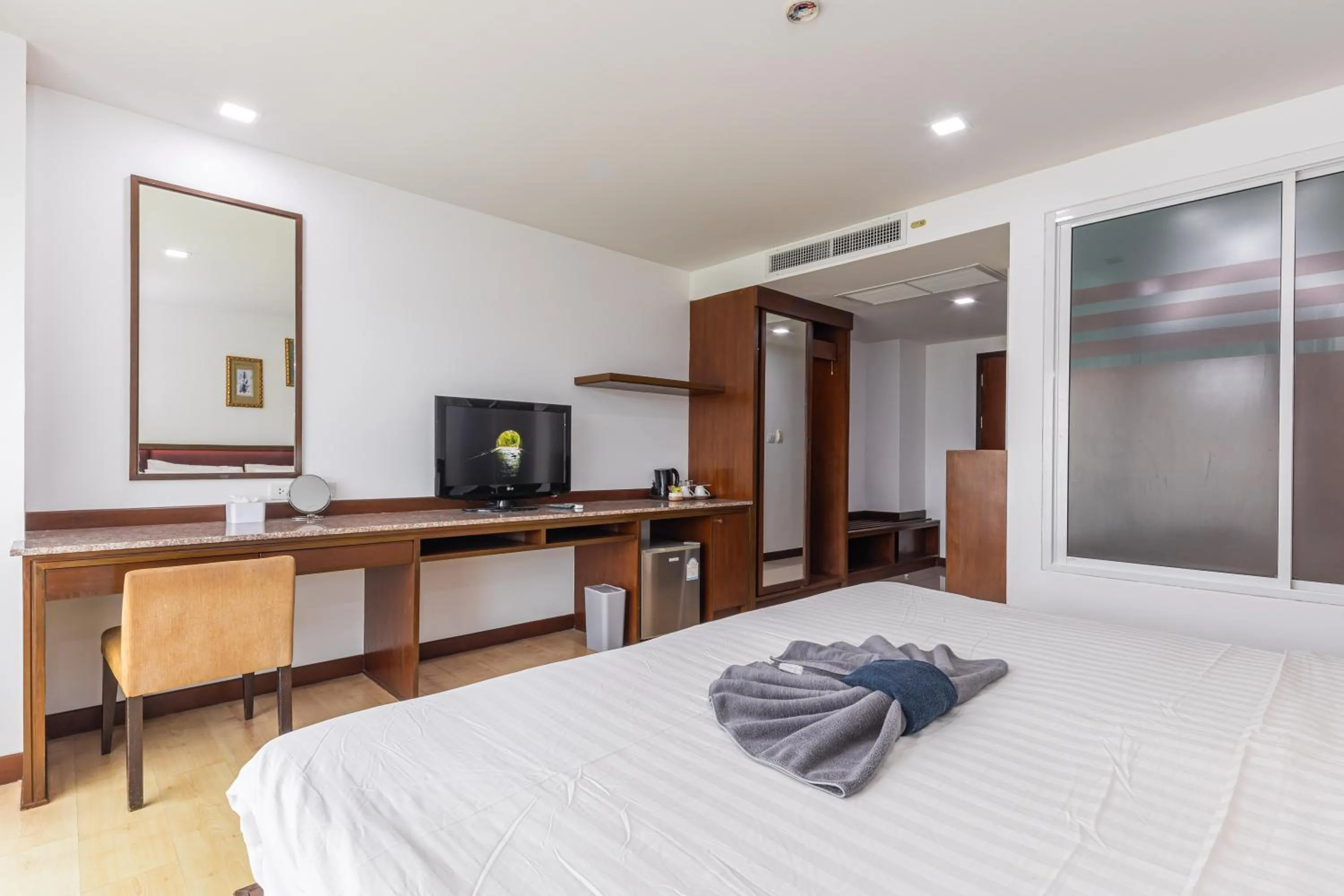 Bed in The Kris Resort Hotel