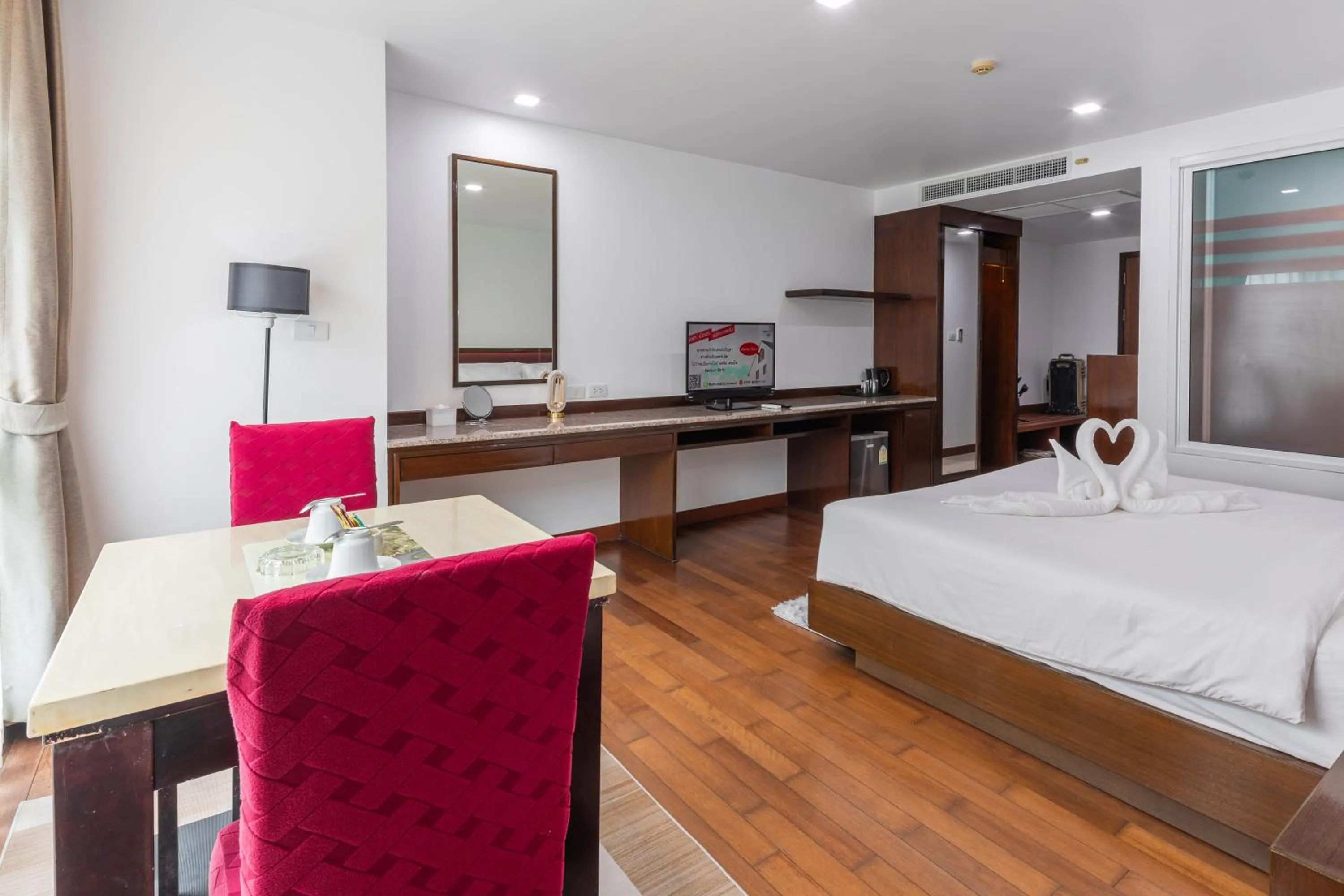 Bed in The Kris Resort Hotel