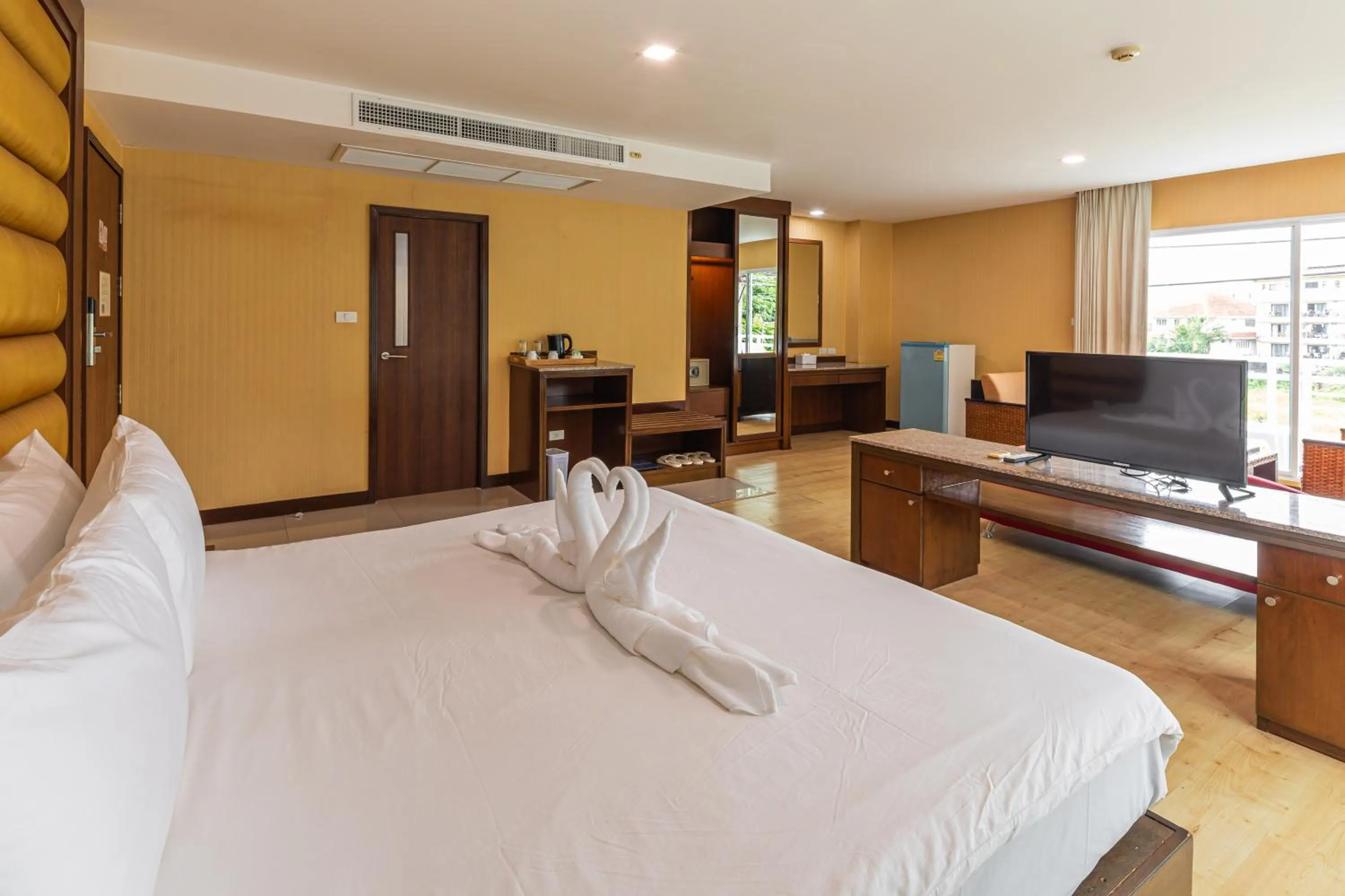 Bed in The Kris Resort Hotel