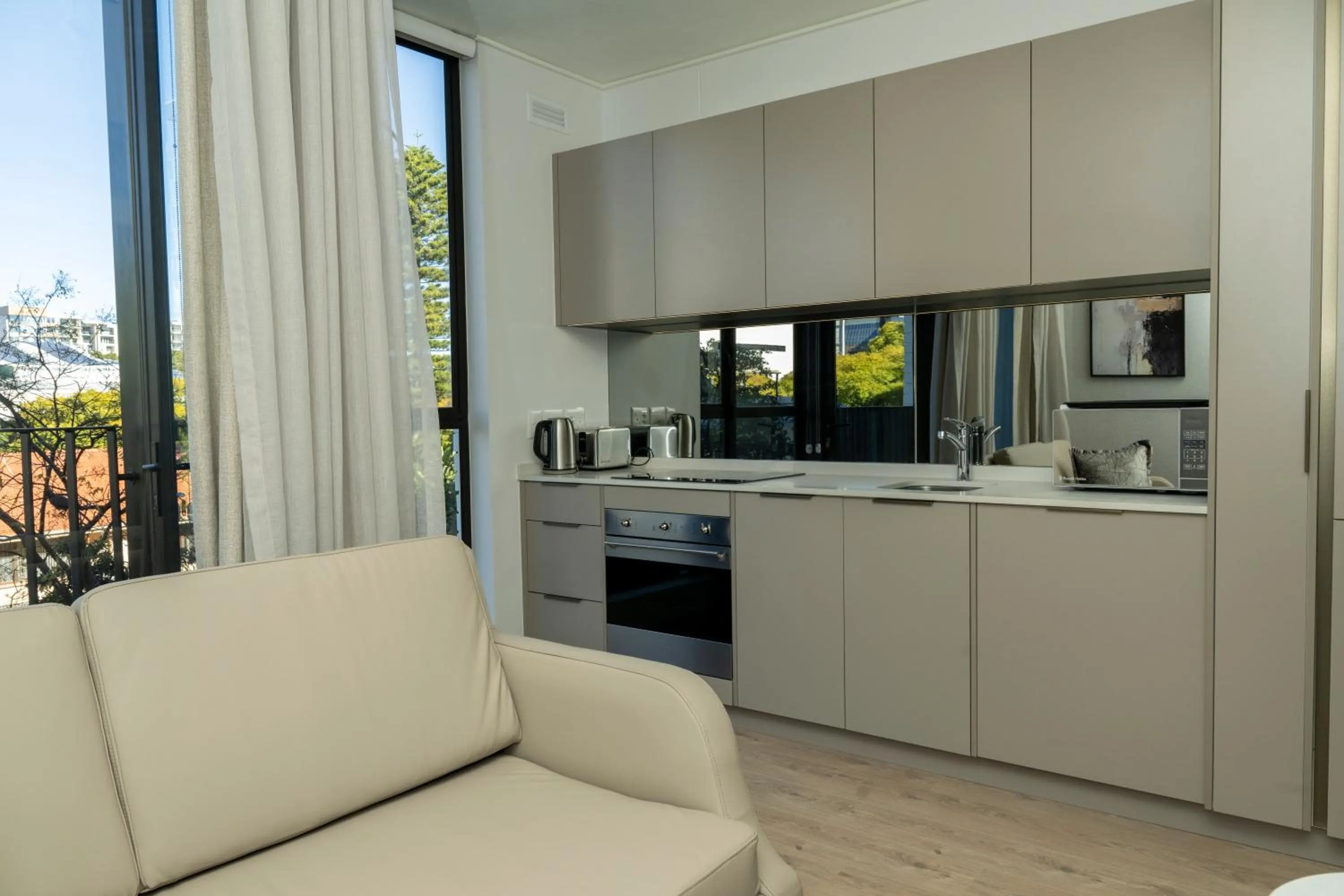 Living room in One Rosebank Executive Apartment Hotel