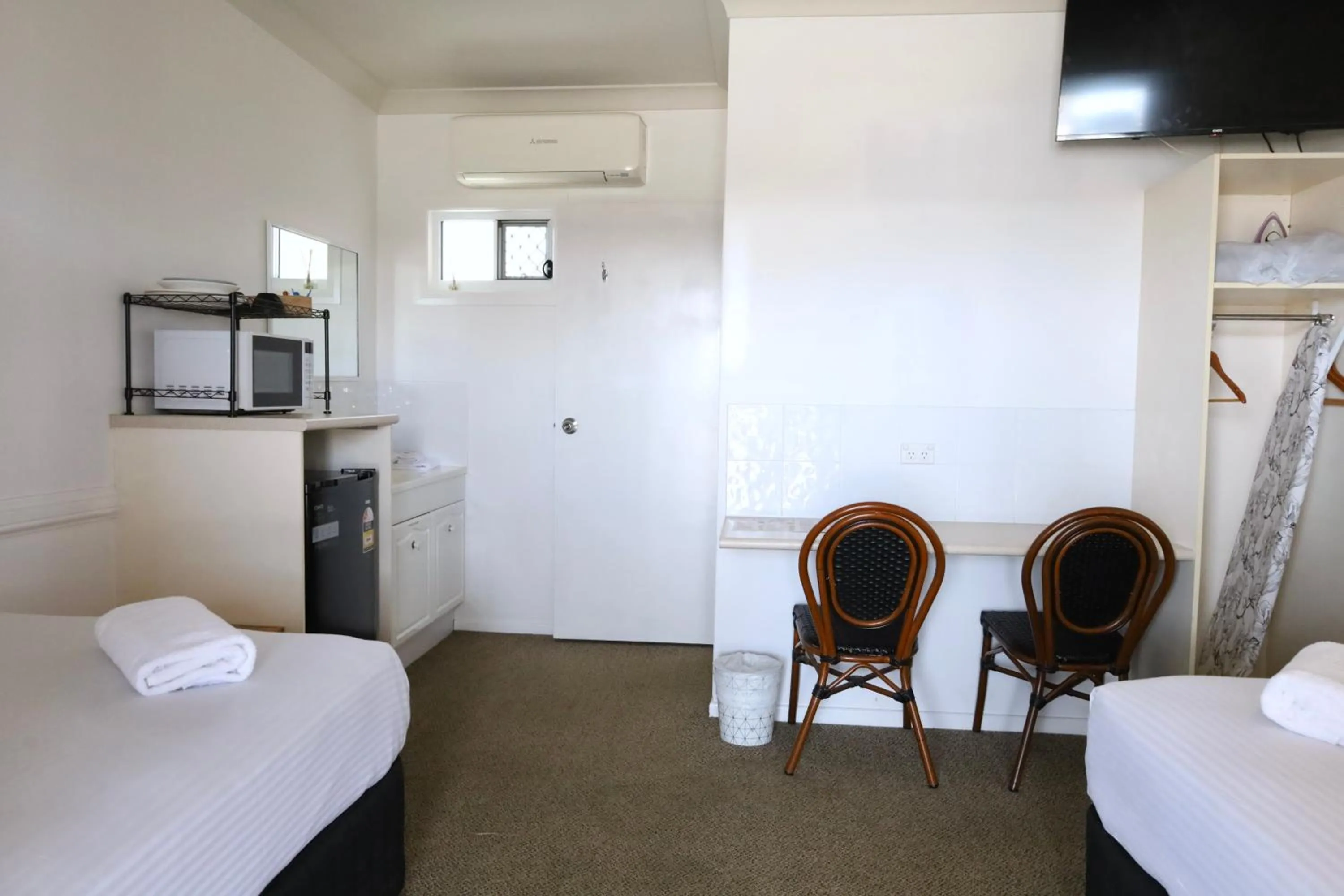 Bed in Park Avenue Hotel Motel