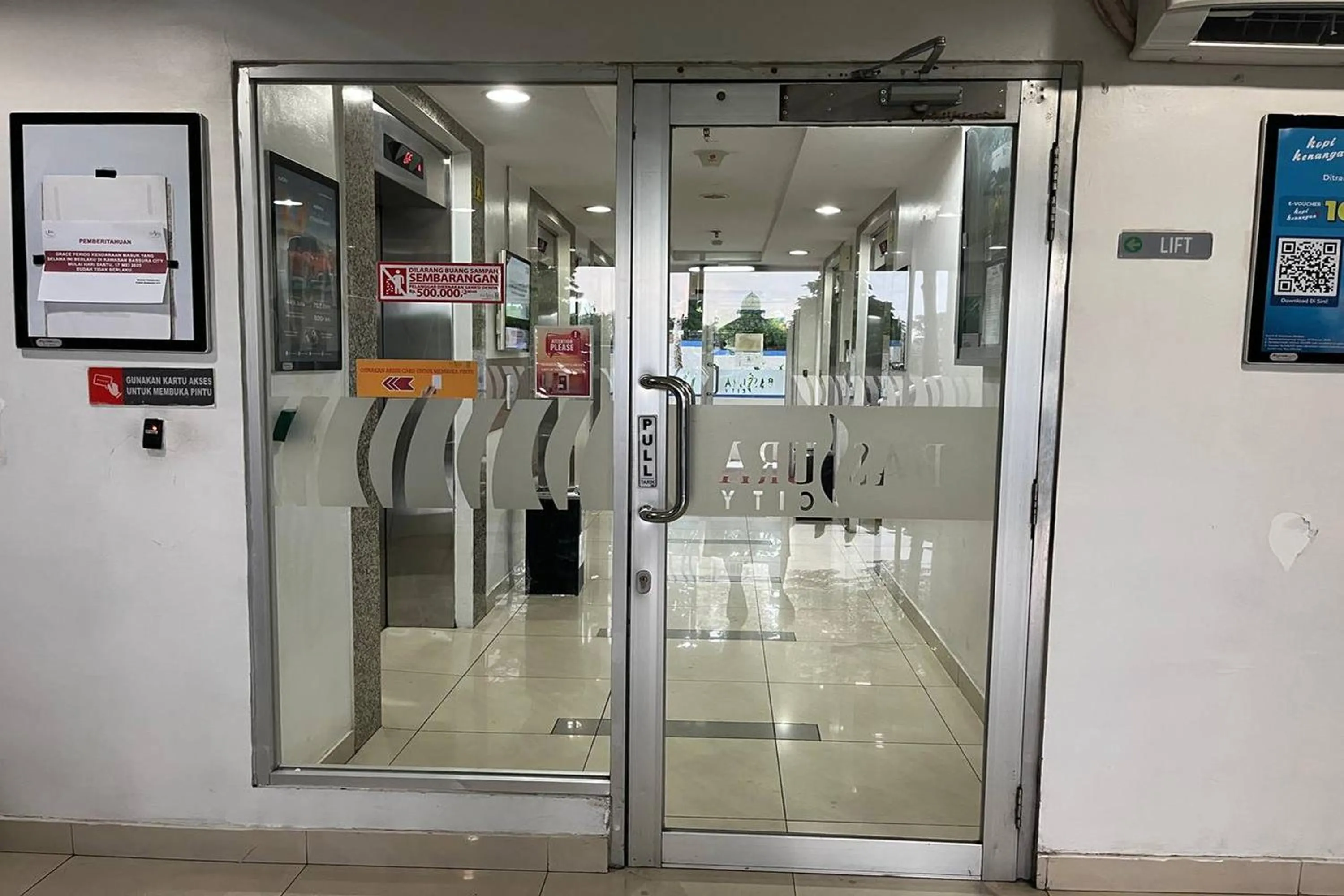 elevator in Apartment Bassura City by Berkah Estate