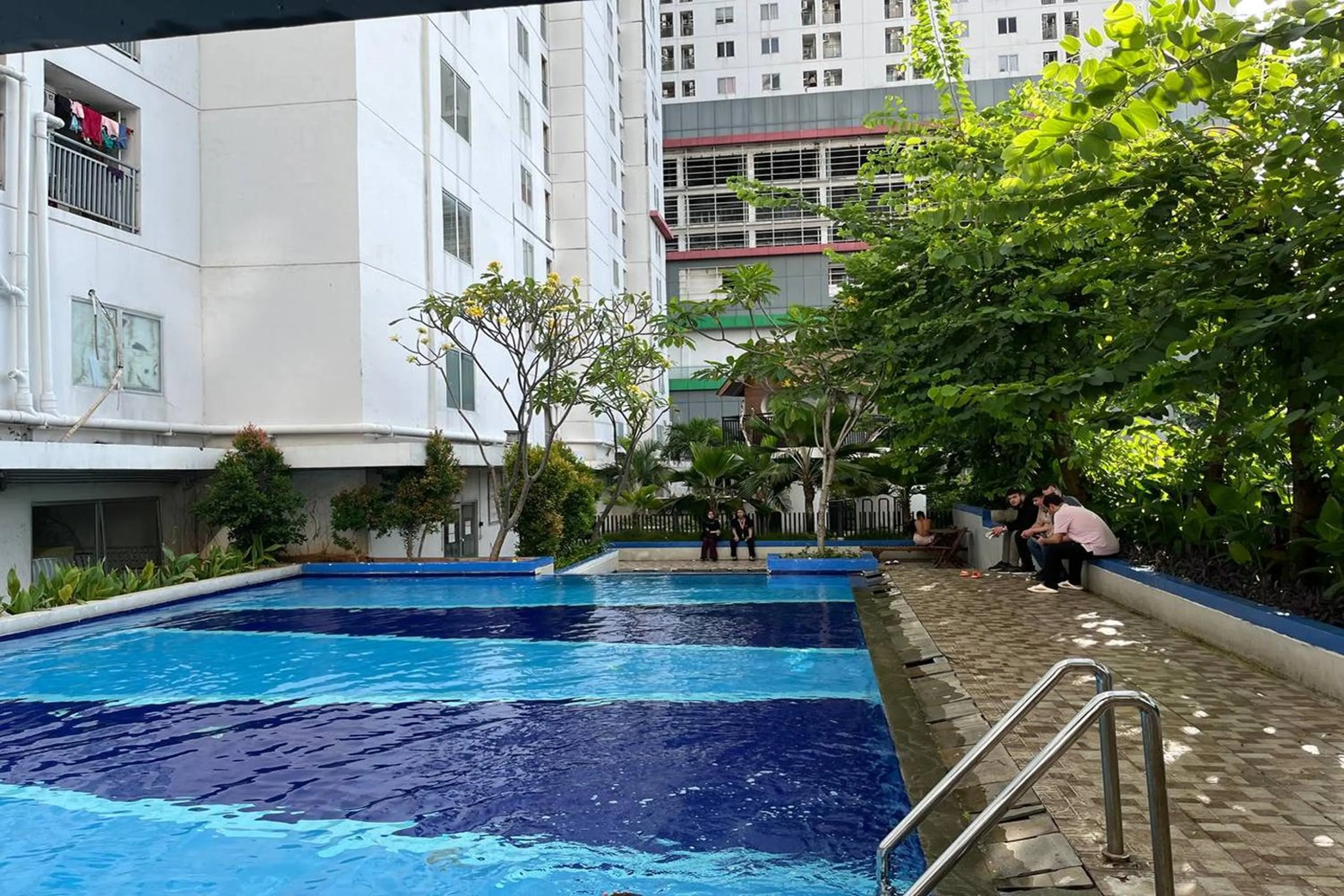 Swimming pool in Apartment Bassura City by Berkah Estate