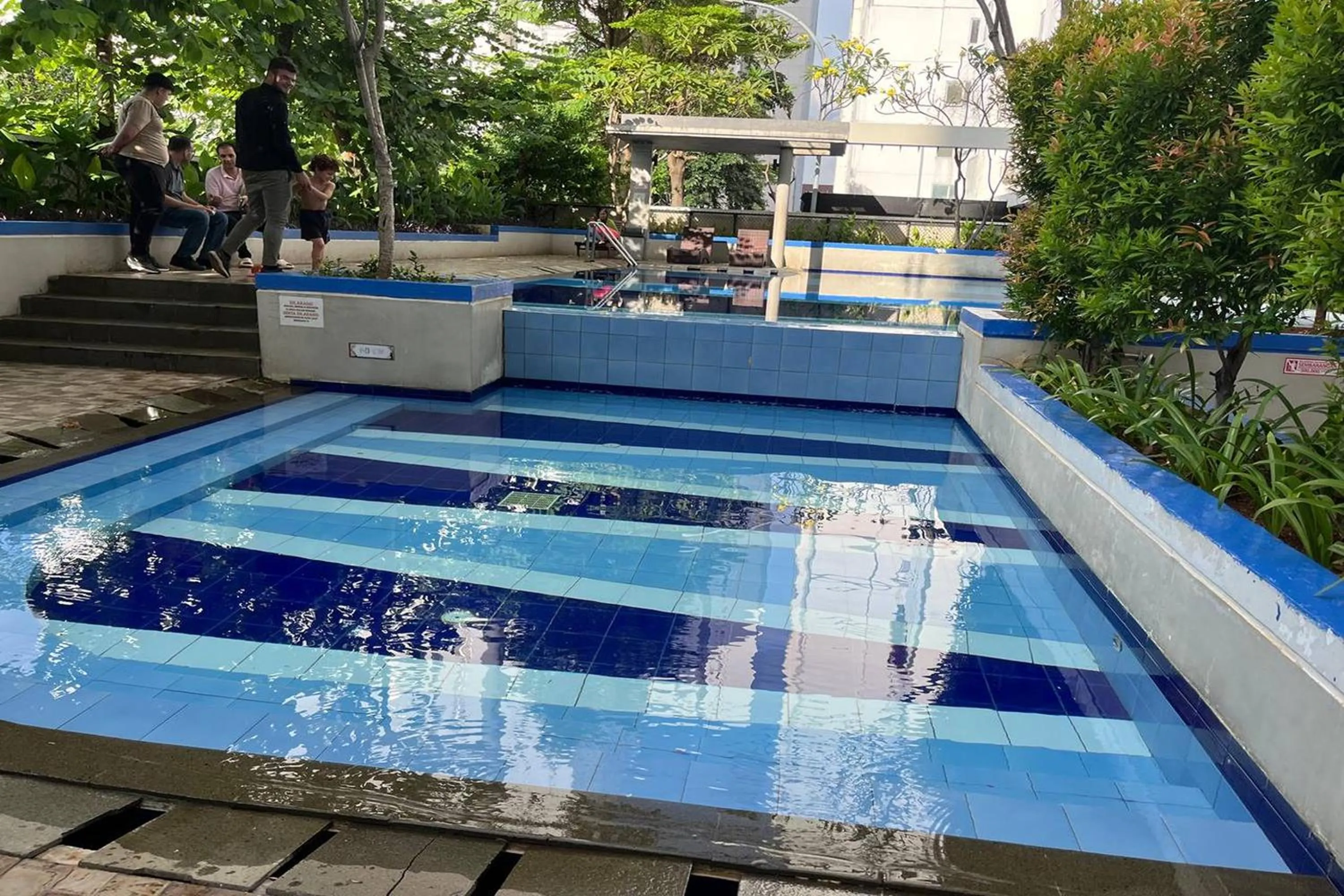 Swimming pool in Apartment Bassura City by Berkah Estate