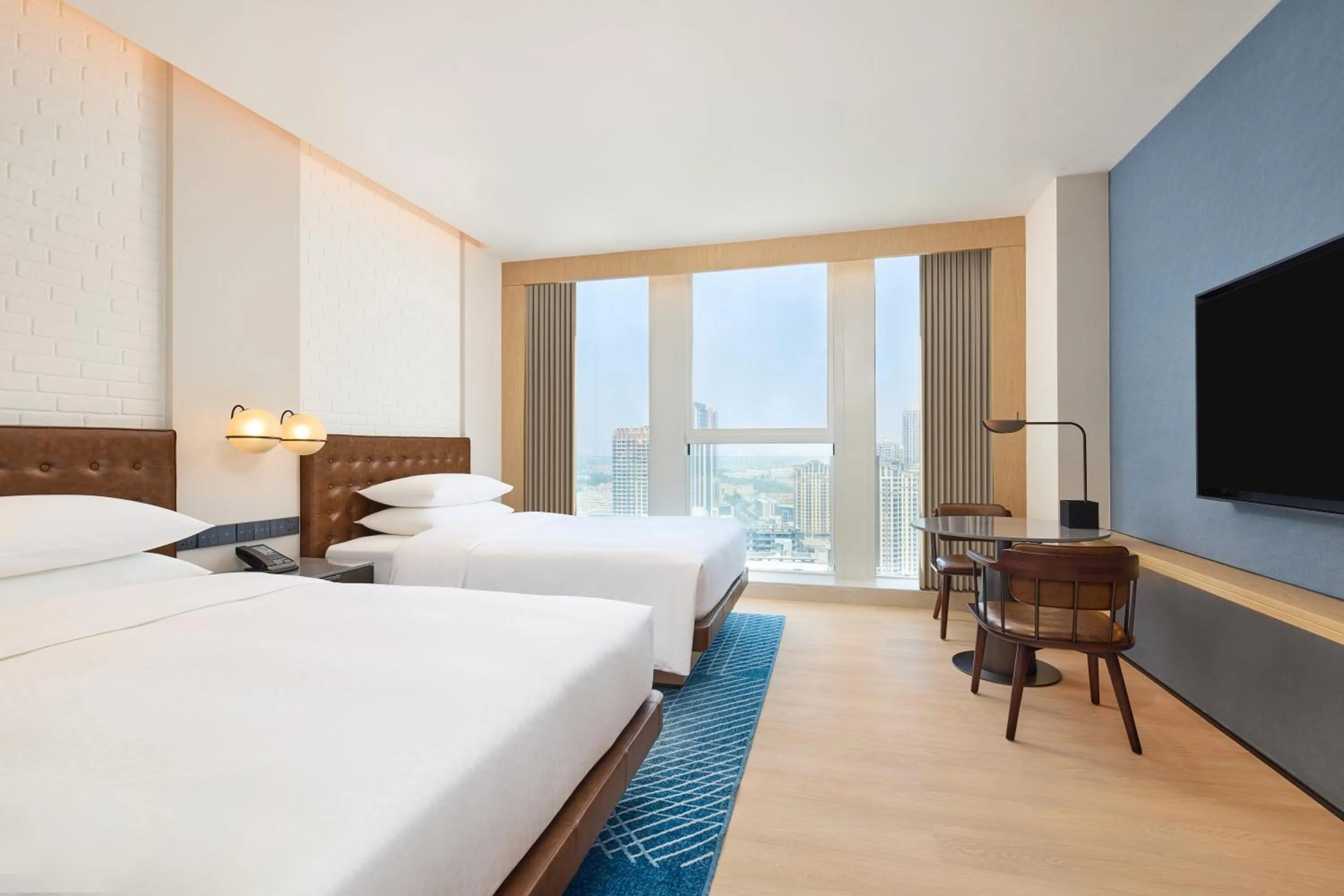 Communal lounge/ TV room, Bed in Four Points by Sheraton Rizhao