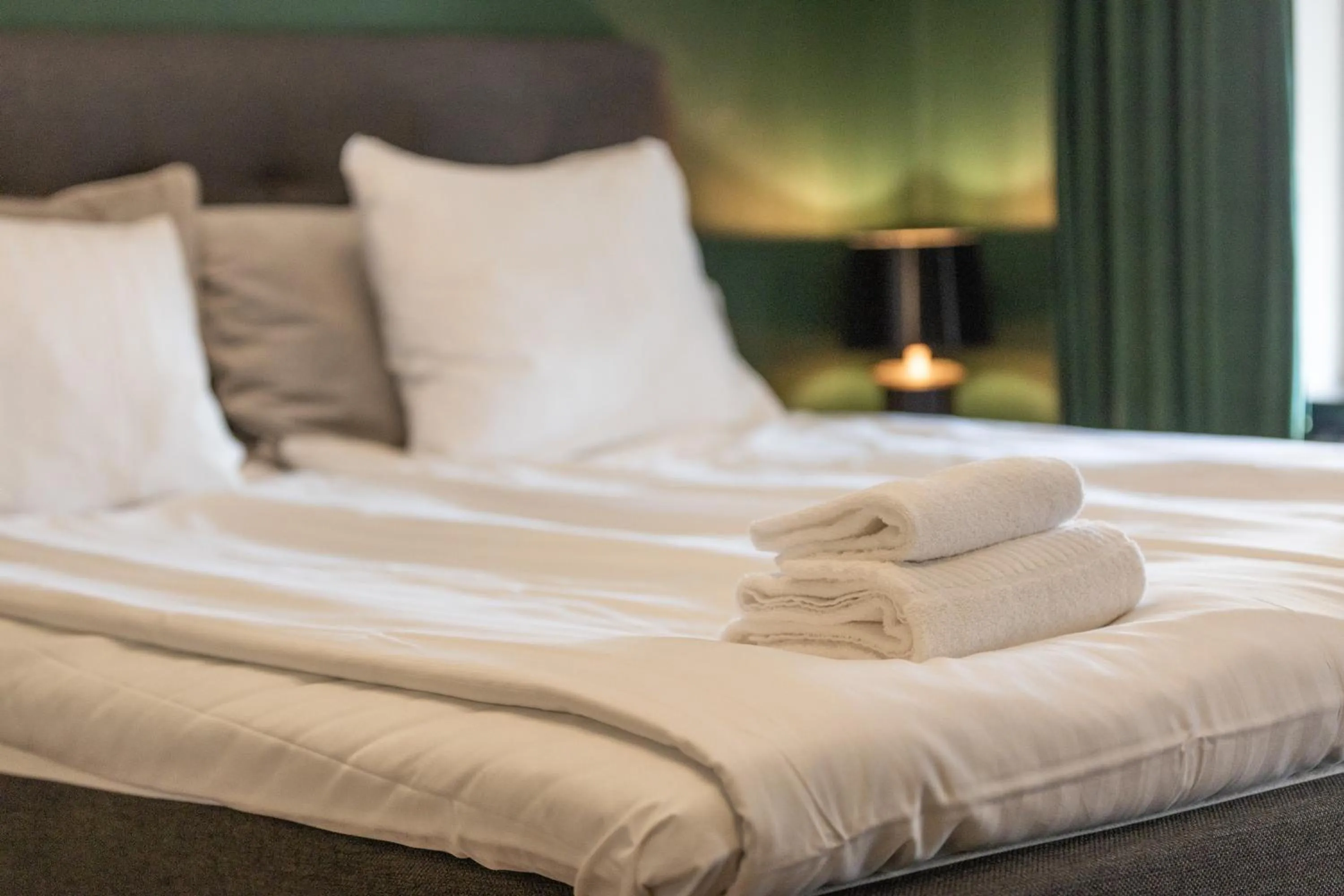 Bed in Cameo Boutique Hotell