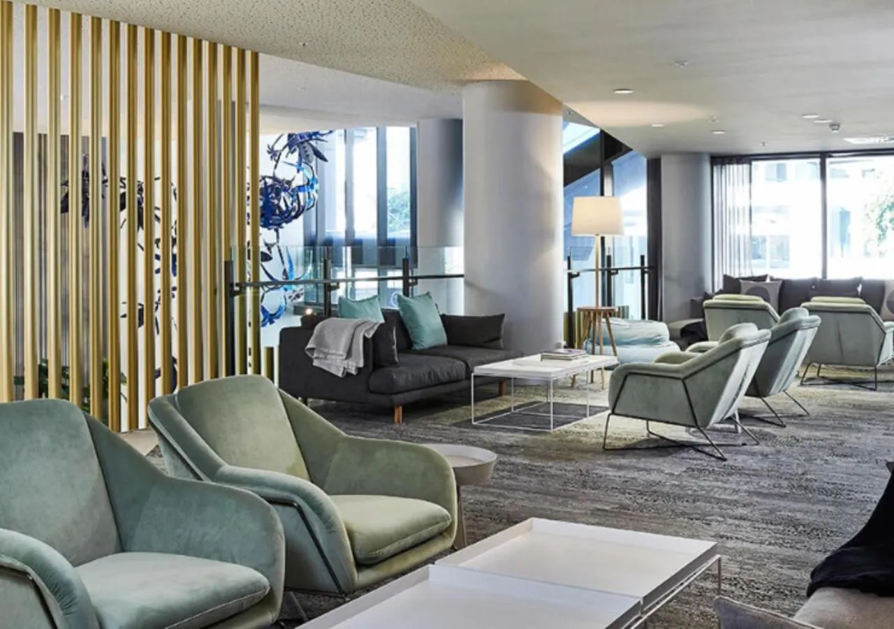 Seating area in Spire Residences by CLLIX