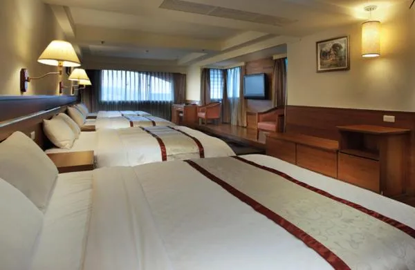 Bed in Cheng Pao Hotel