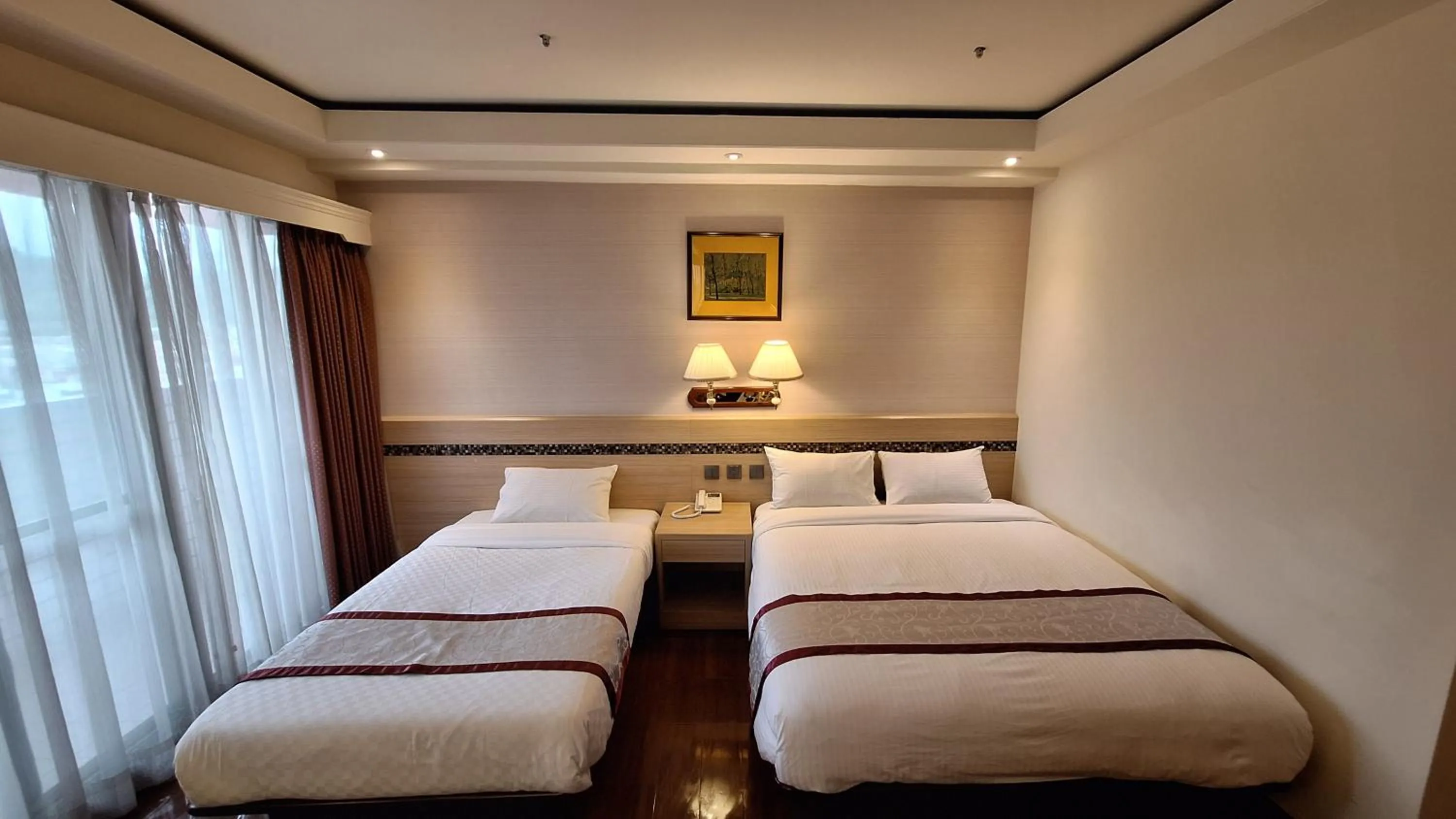 Bed in Cheng Pao Hotel