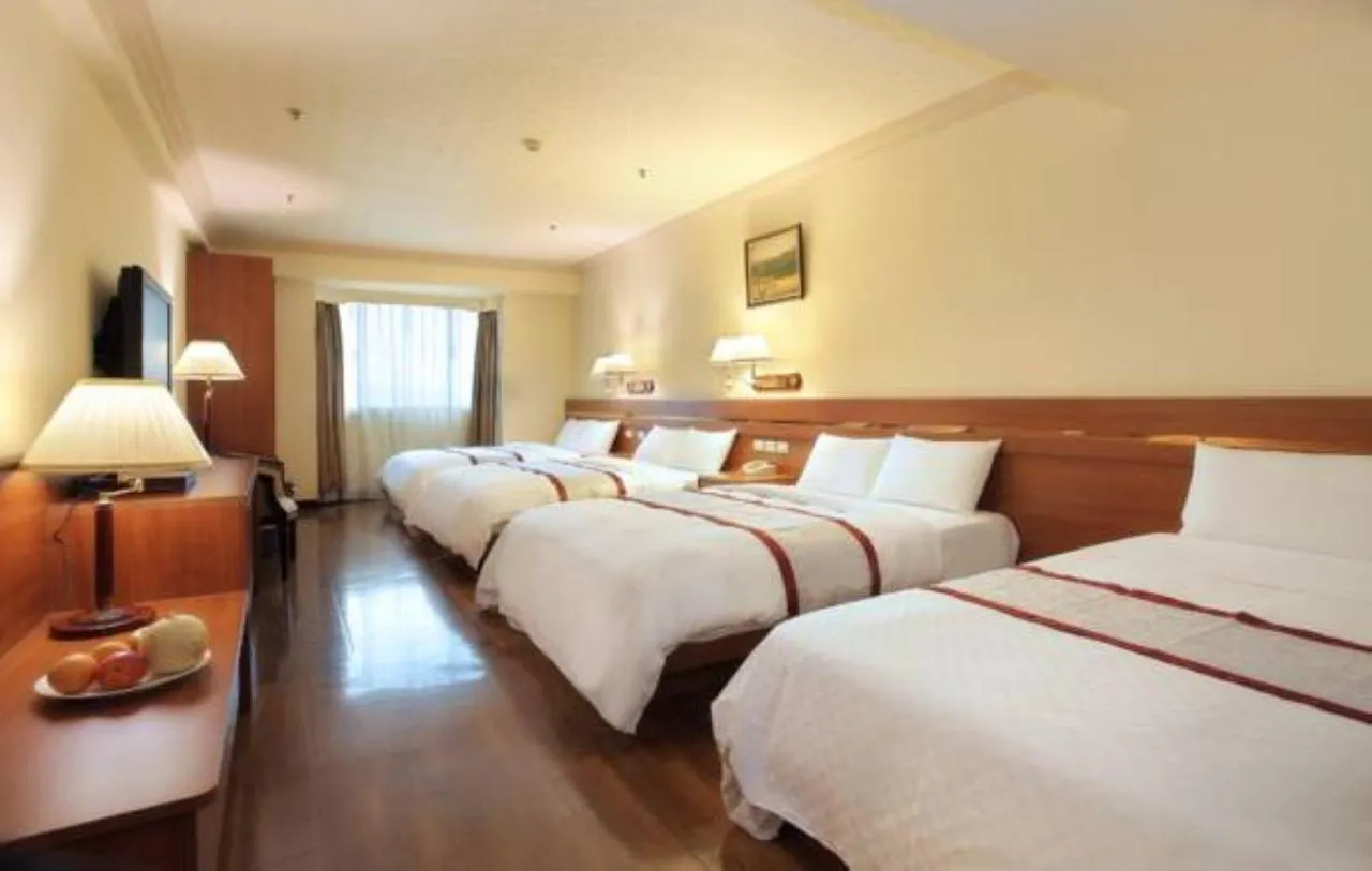 Bed in Cheng Pao Hotel