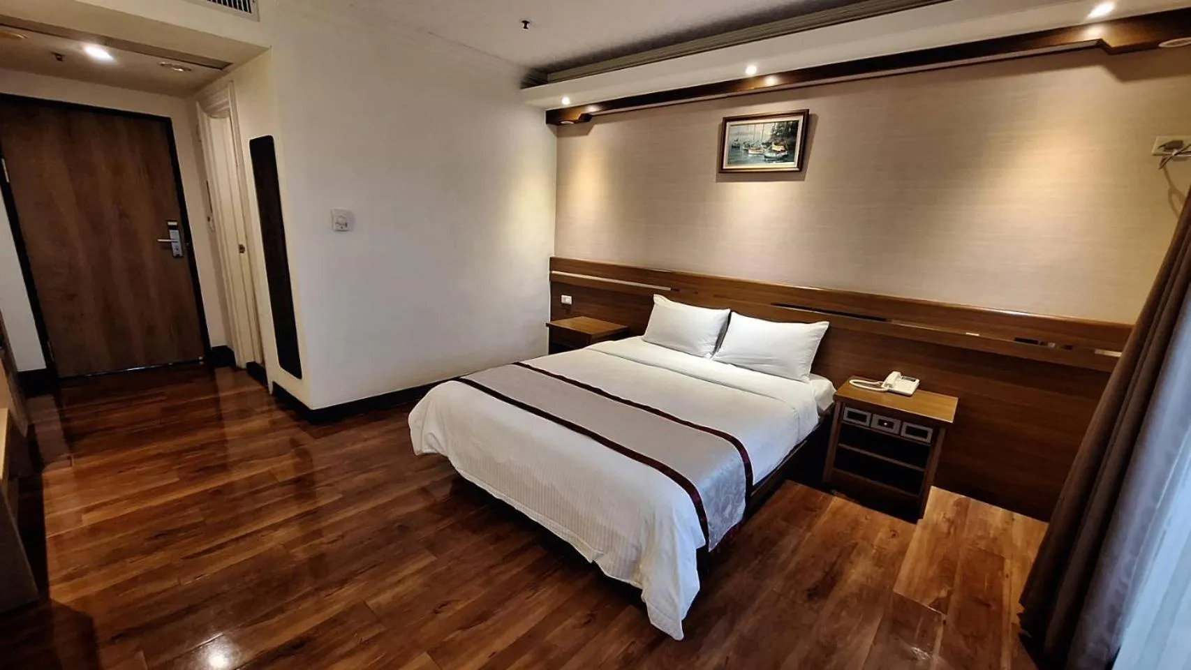 Bed in Cheng Pao Hotel