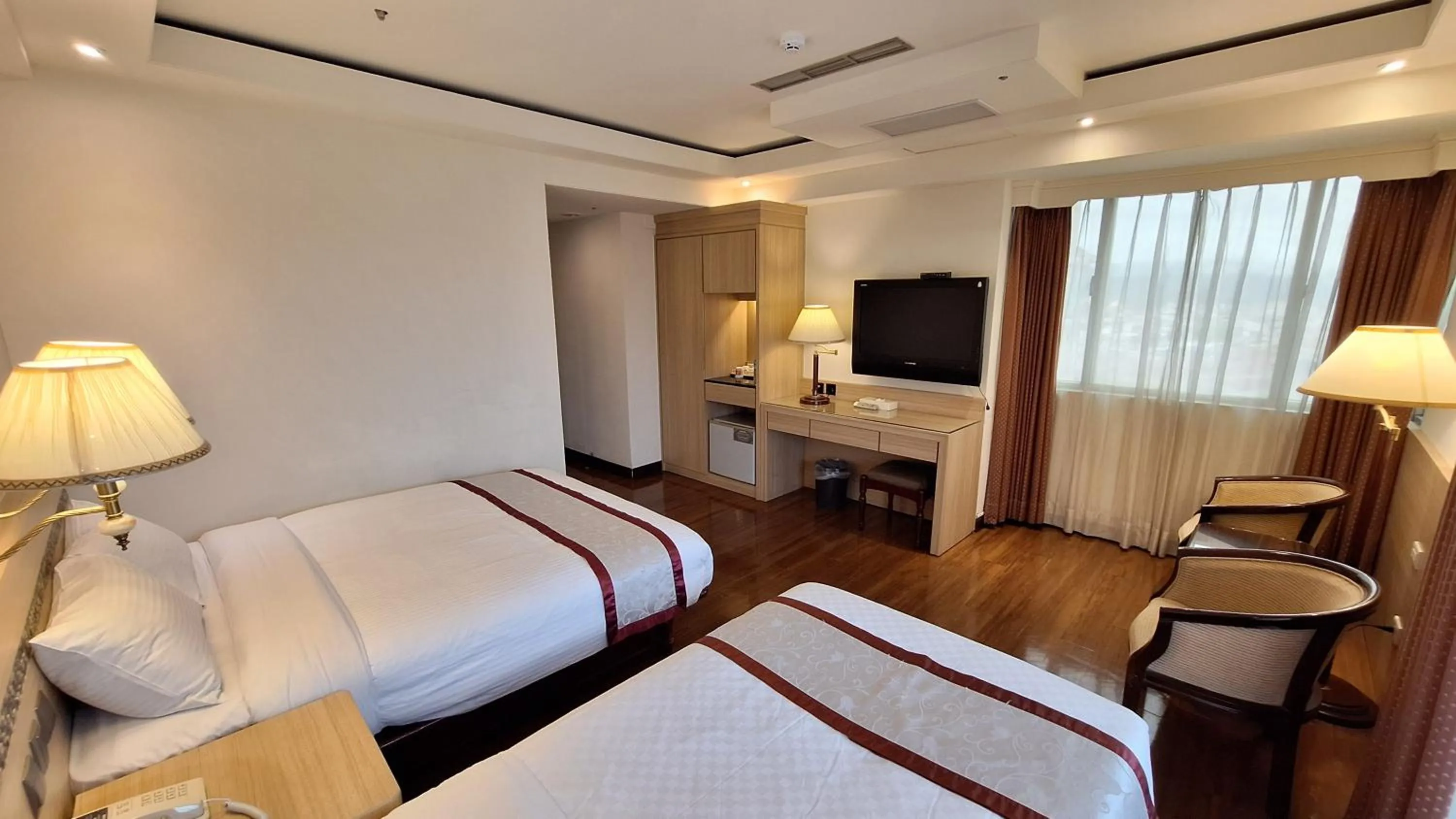 Bed in Cheng Pao Hotel