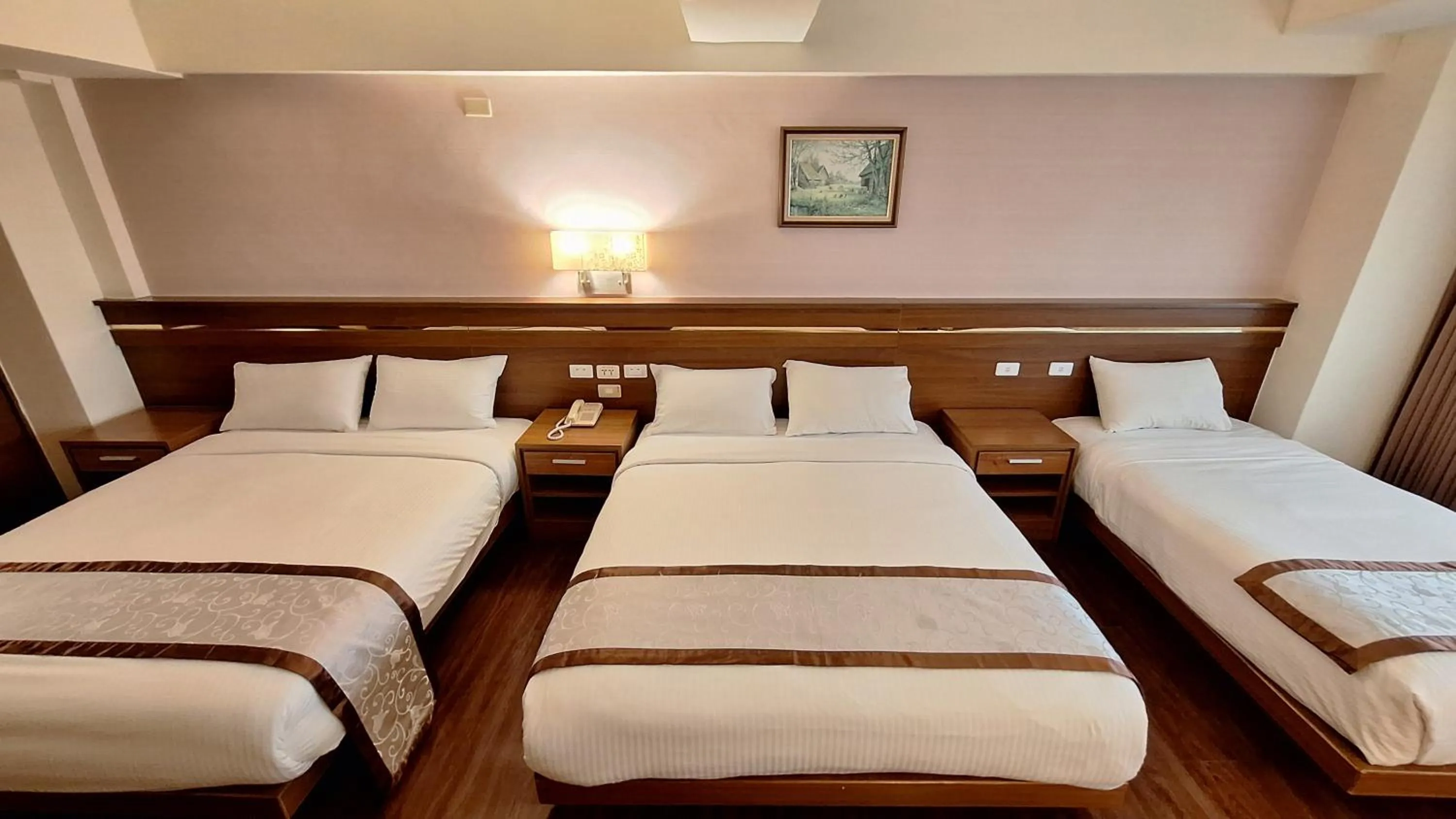 Bed in Cheng Pao Hotel