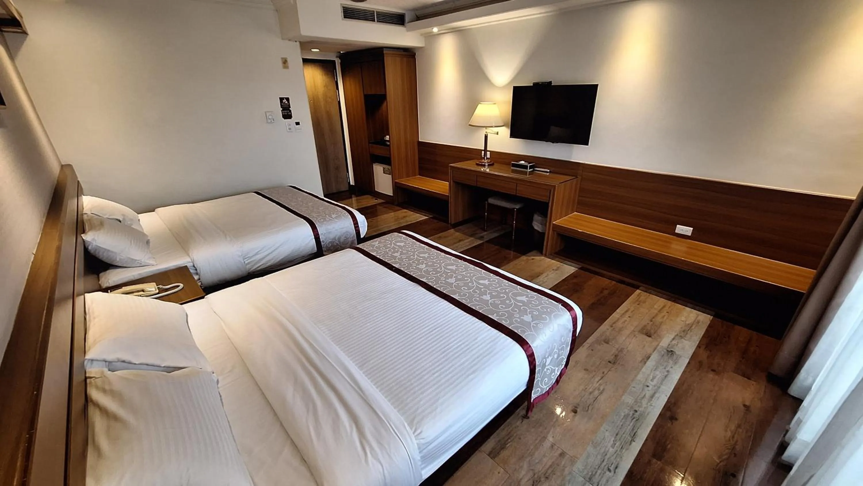 Bed in Cheng Pao Hotel