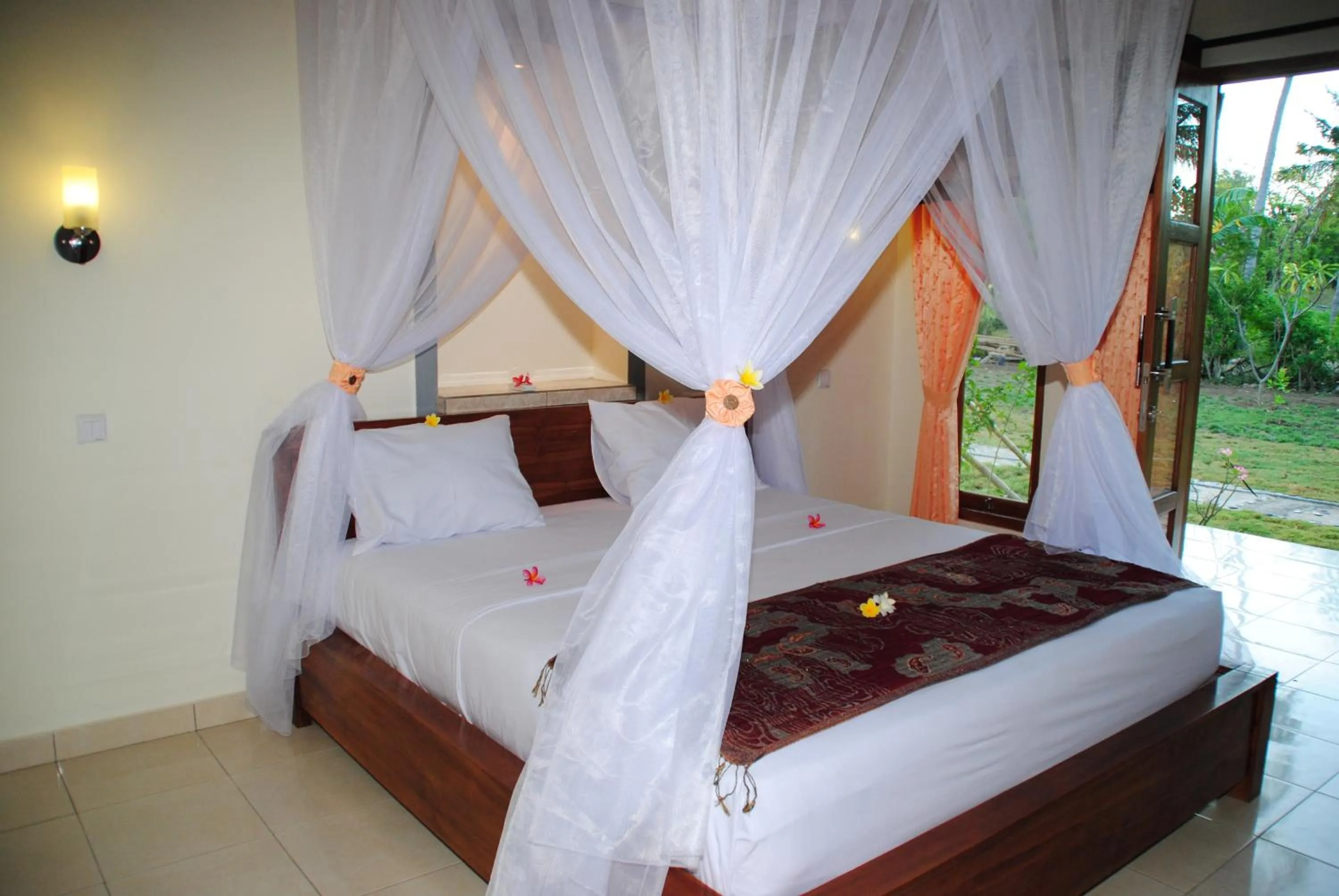 Photo of the whole room, Bed in Tiara Homestay Pemuteran Bali
