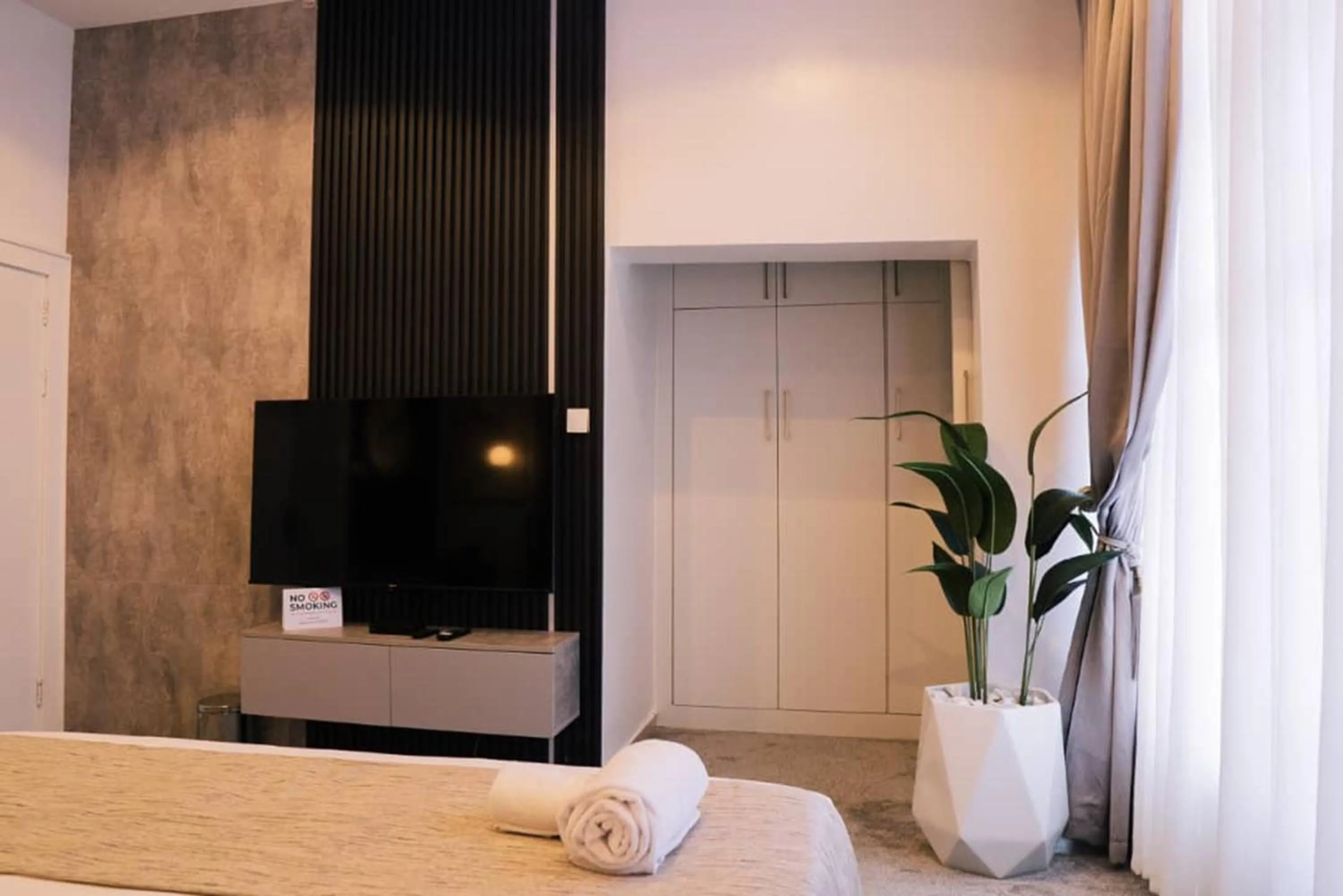 Bed in UrbanEdge Hotel