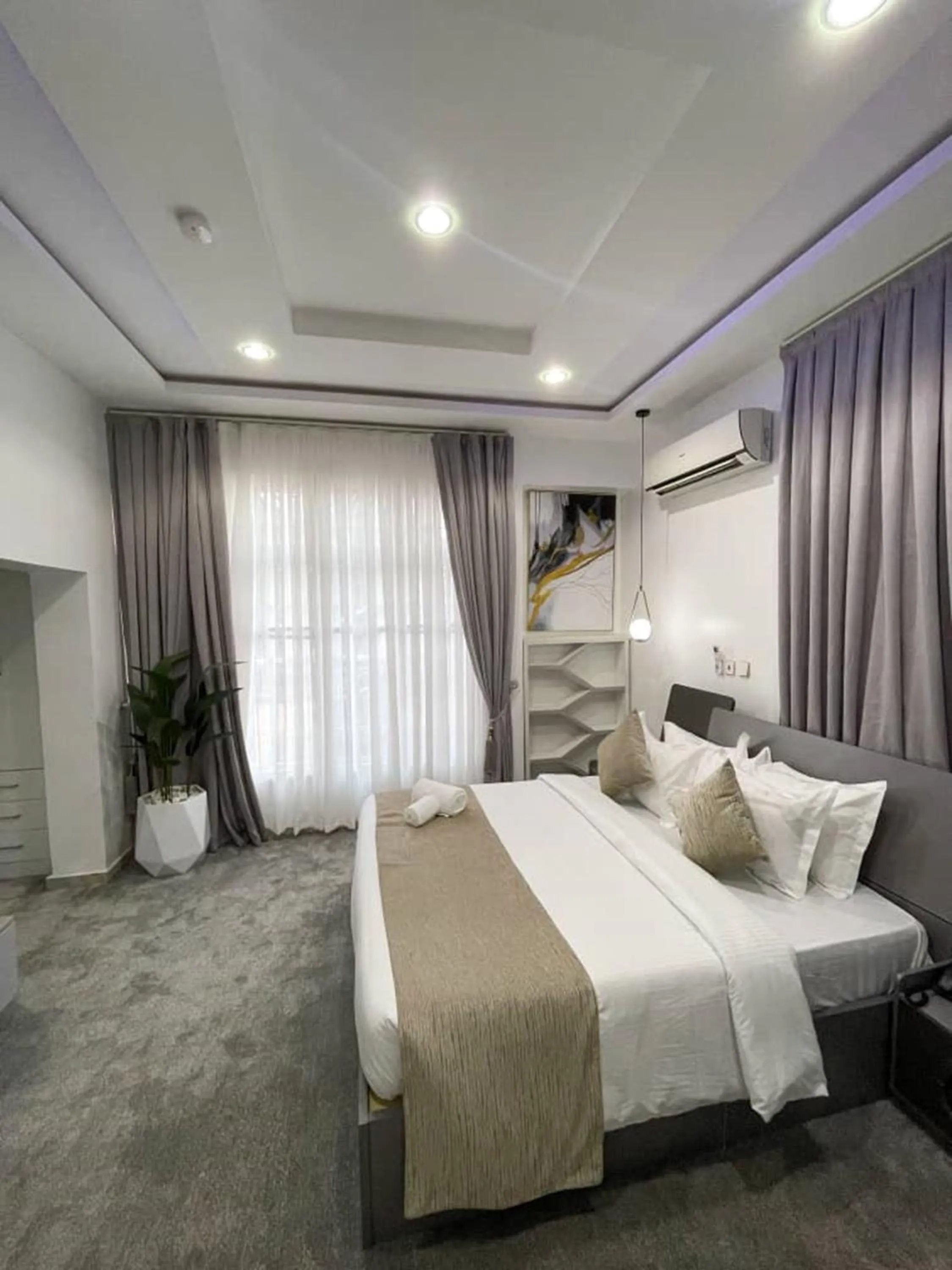 Bed in UrbanEdge Hotel