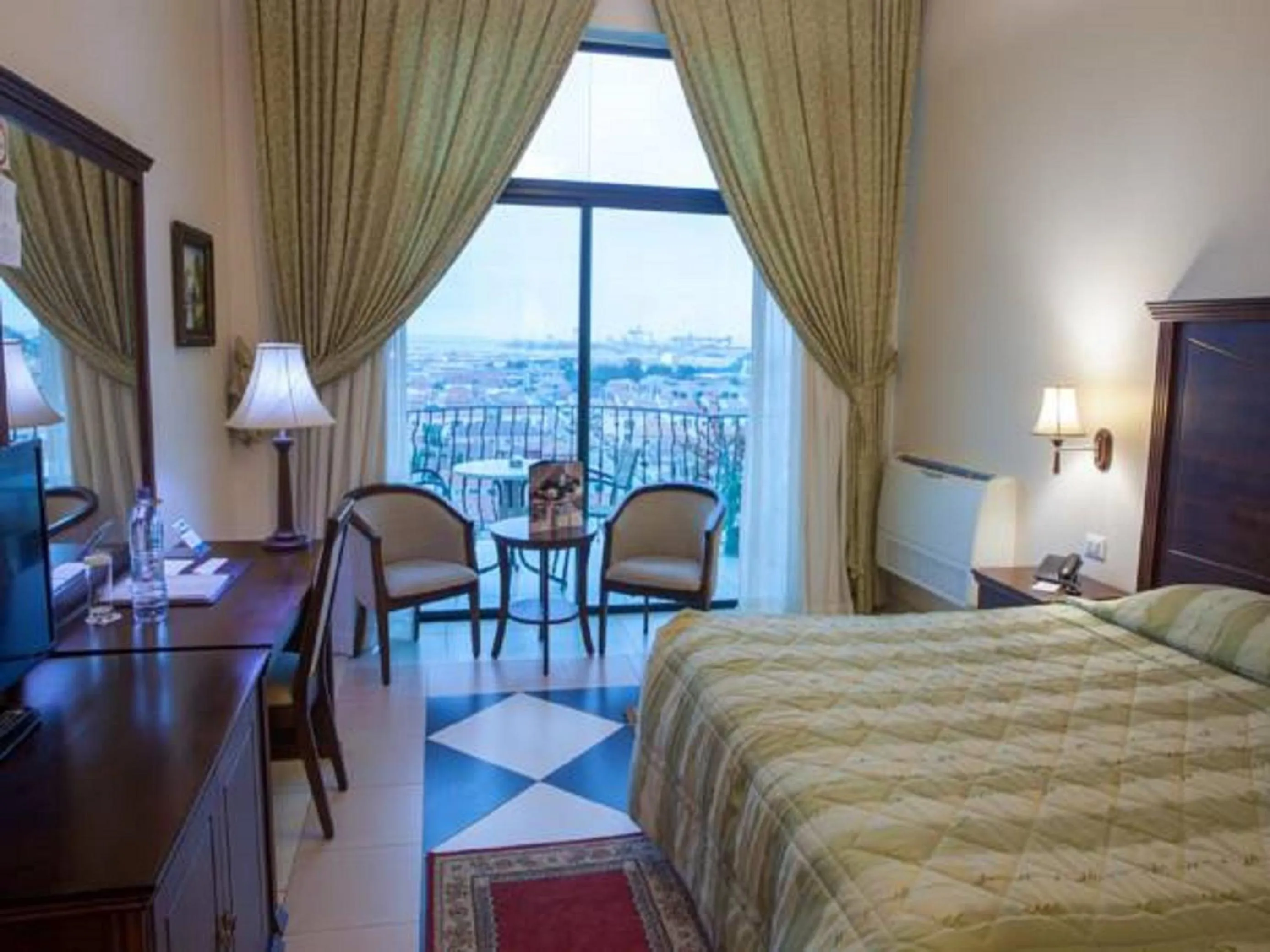 Bed in Atlantic Palace Hotel