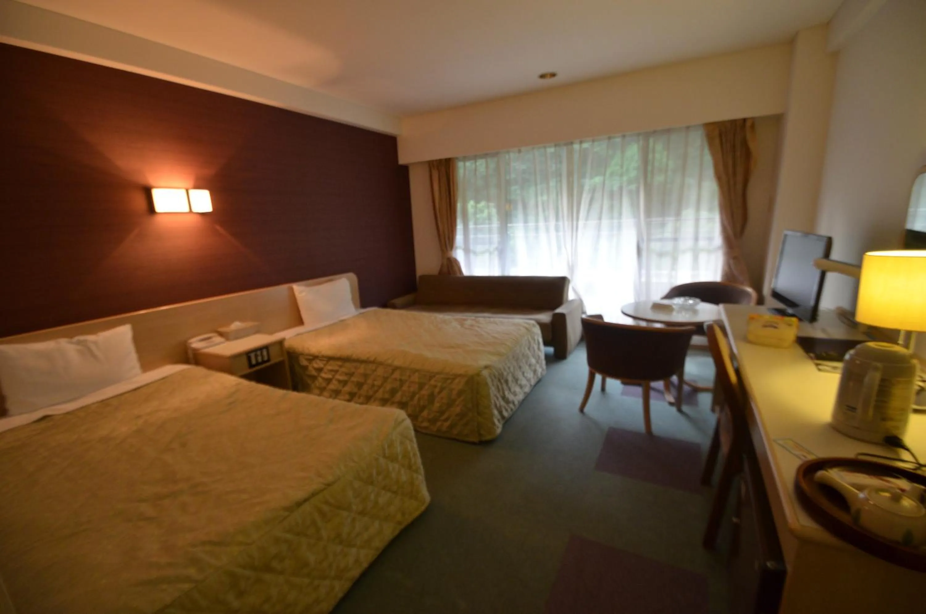 Bed in Shin Kabakawa Kanko Hotel