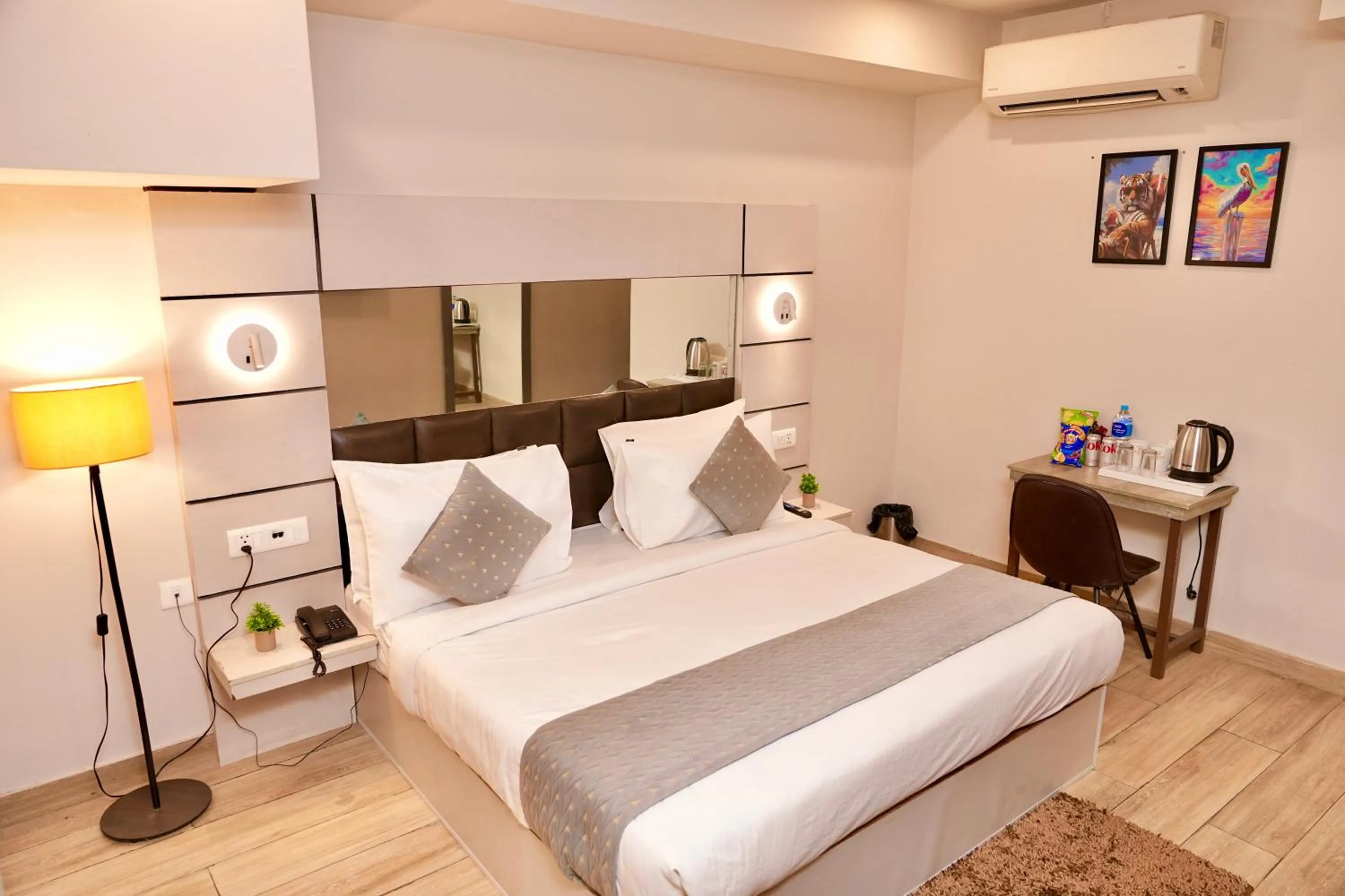 Bed in Hotel Royal Saffron by Majesta Stays