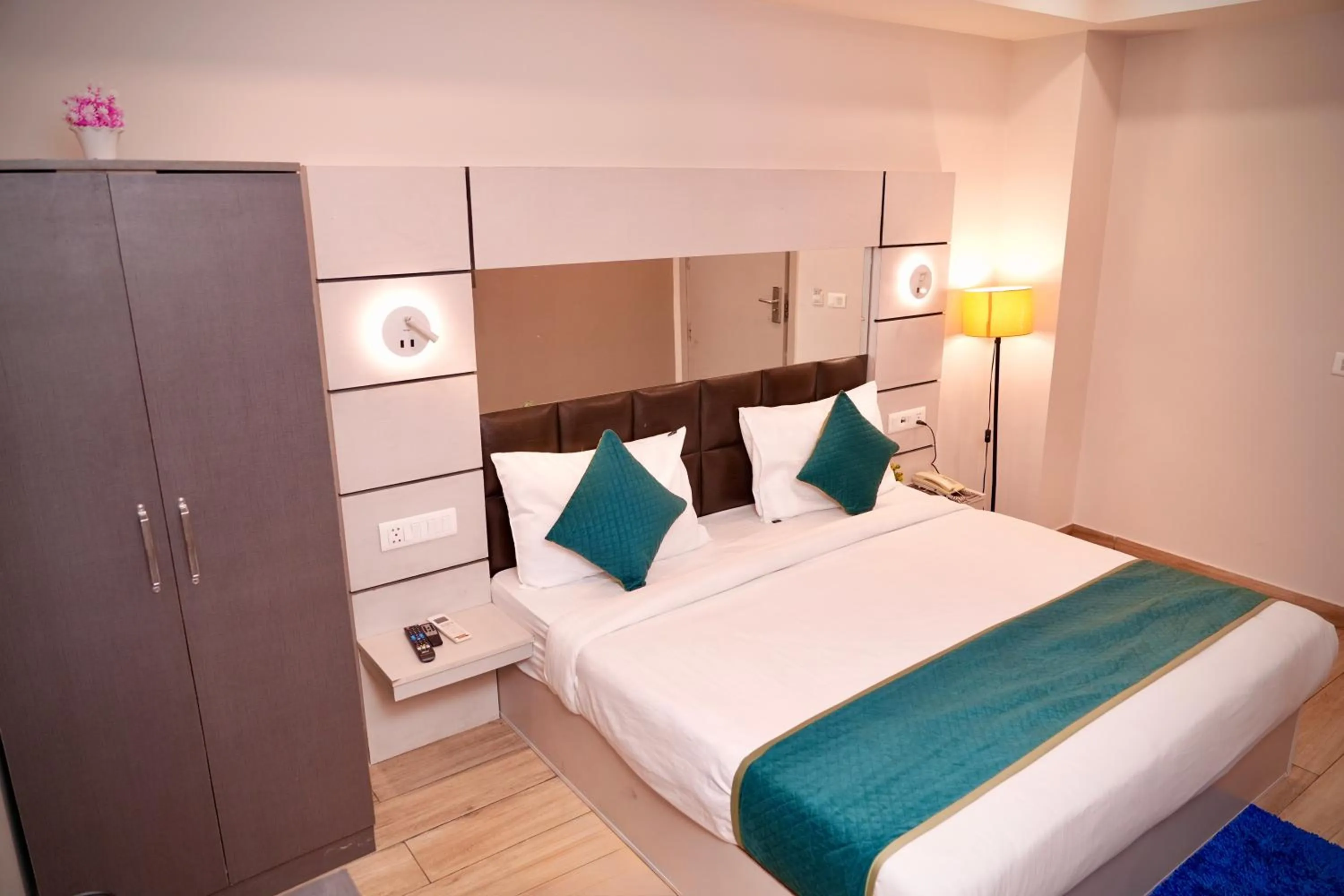 Bed in Hotel Royal Saffron by Majesta Stays