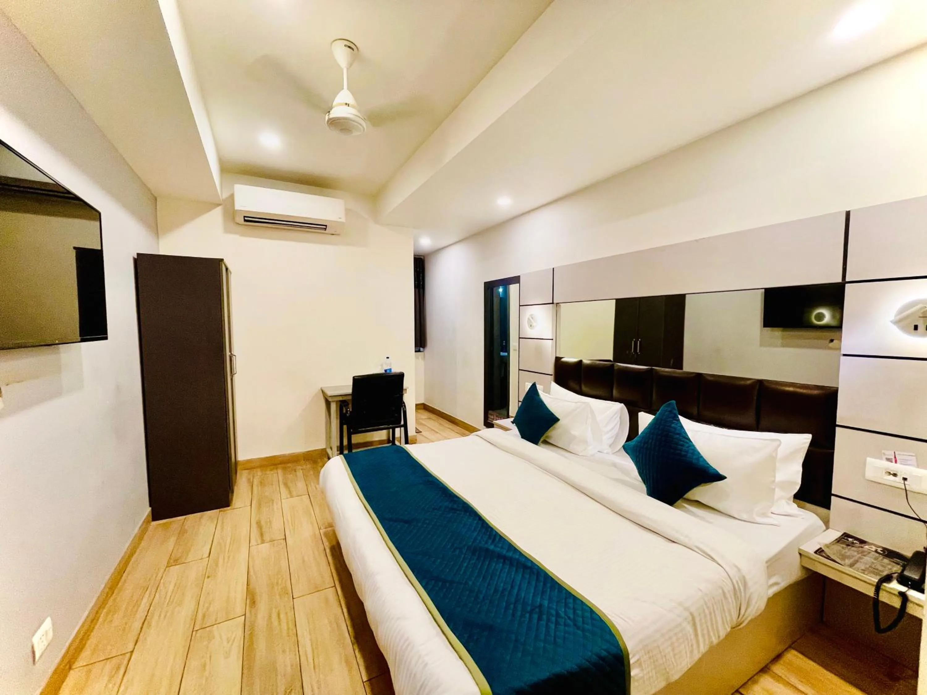 Bed in Hotel Royal Saffron by Majesta Stays