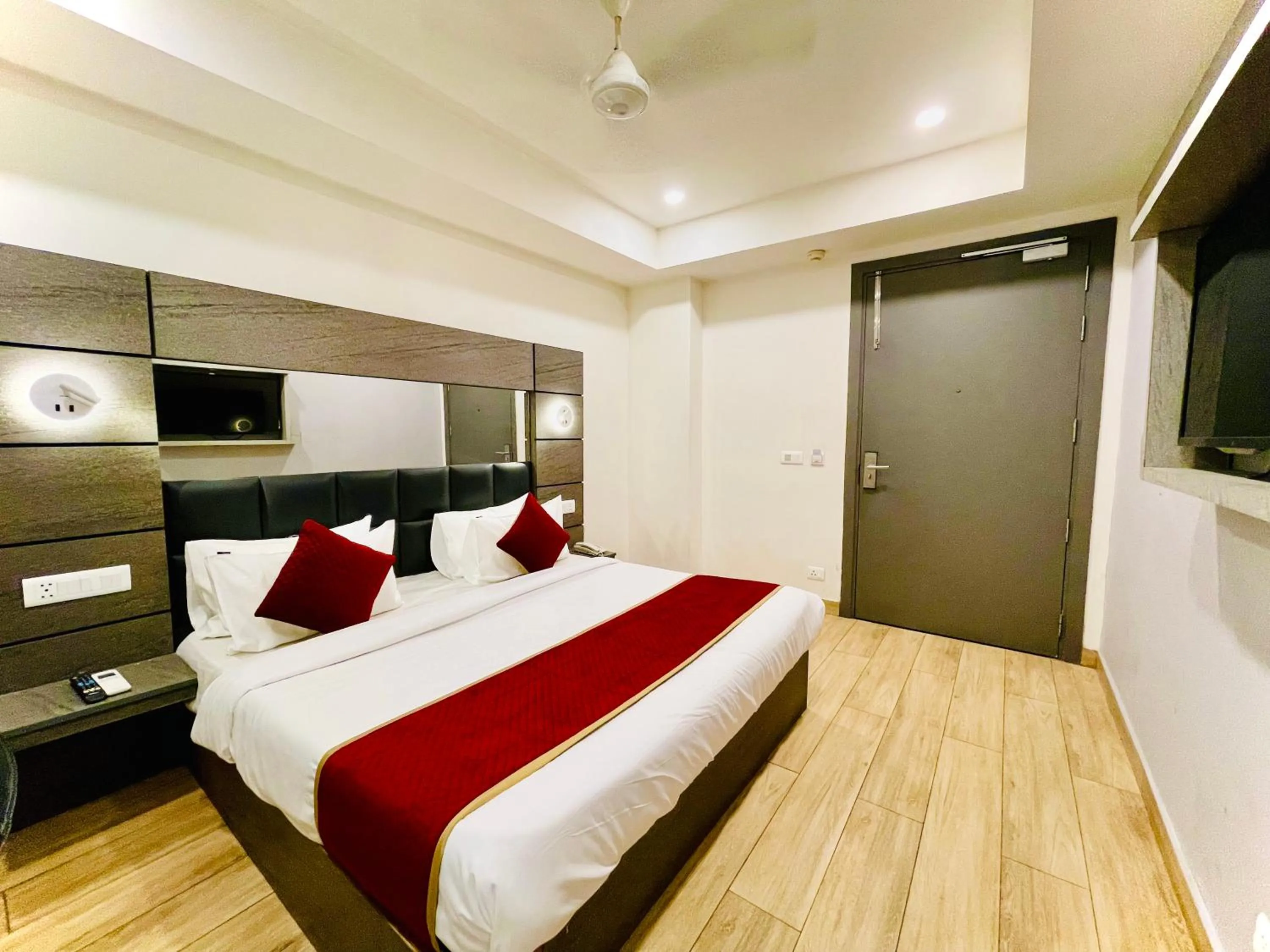 Bed in Hotel Royal Saffron by Majesta Stays