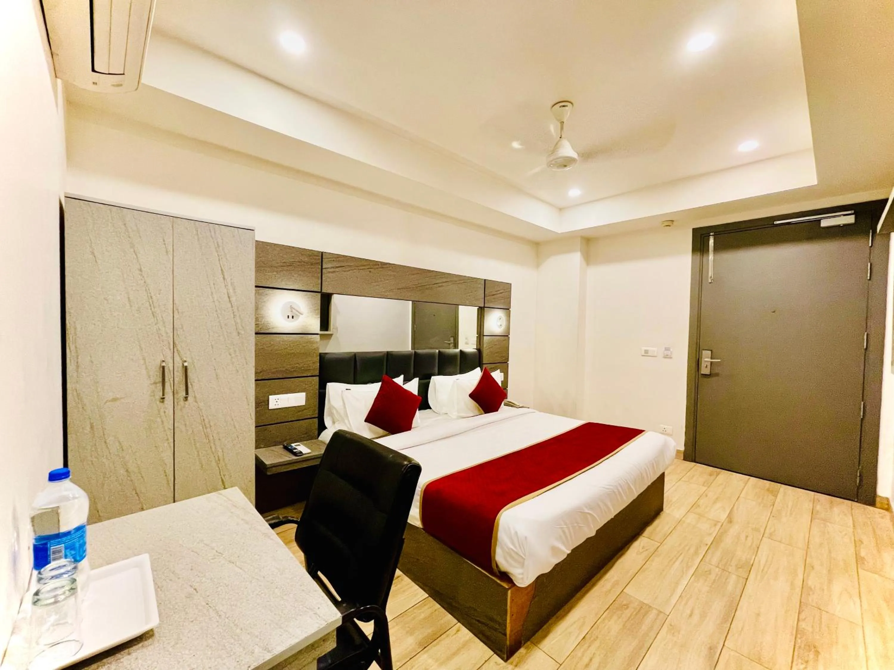 Bed in Hotel Royal Saffron by Majesta Stays