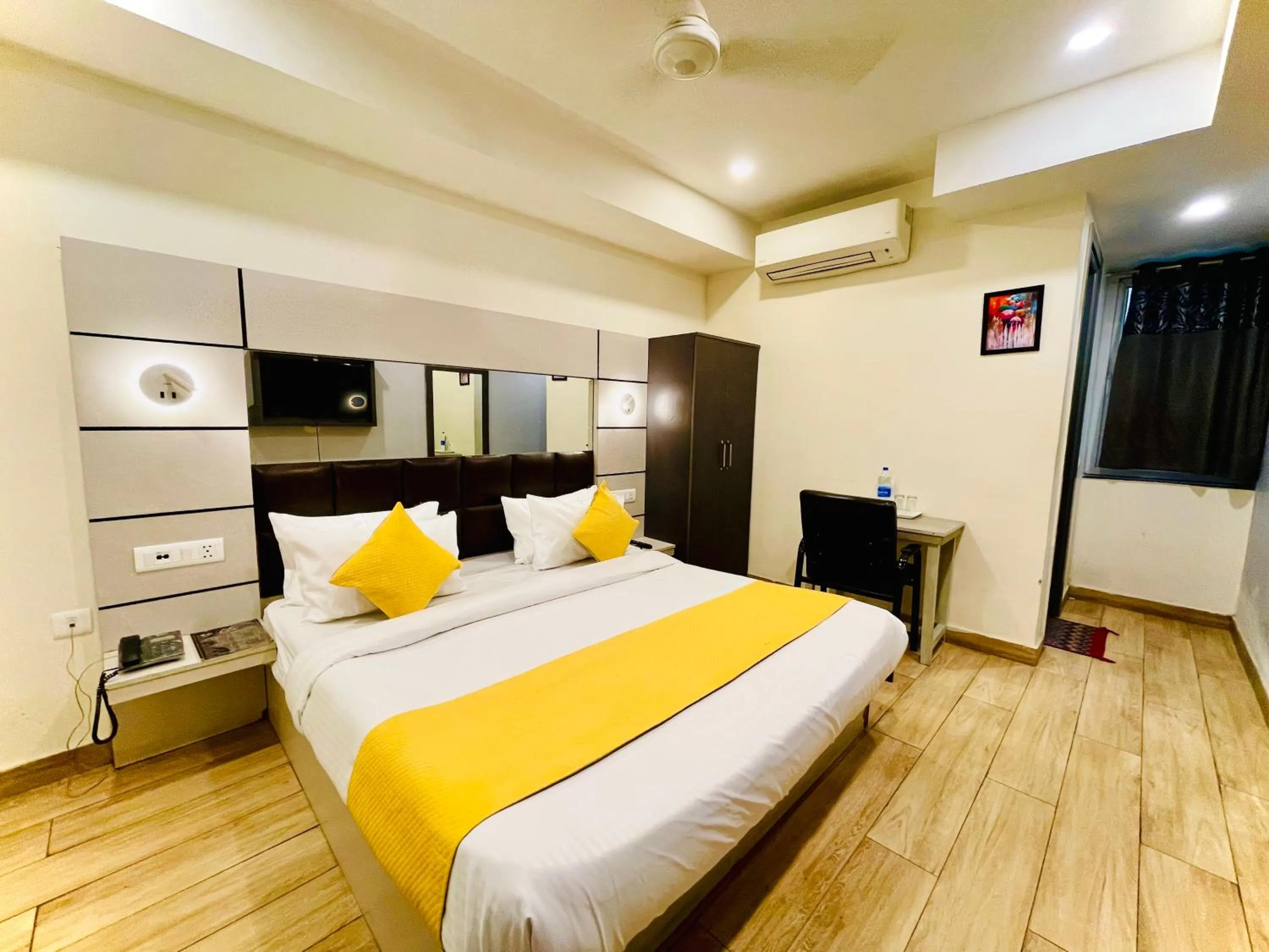 Bed in Hotel Royal Saffron by Majesta Stays