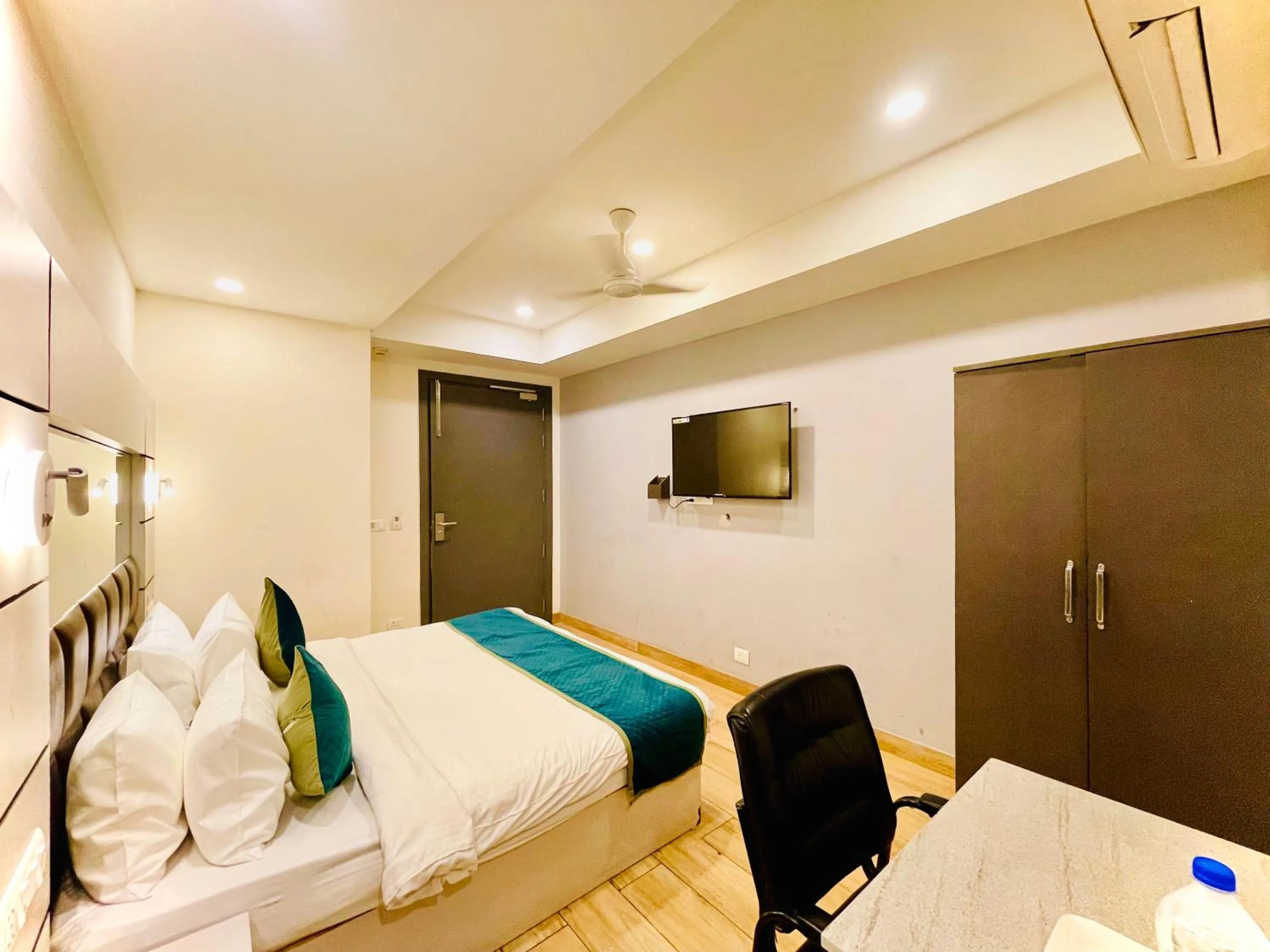 Bed in Hotel Royal Saffron by Majesta Stays