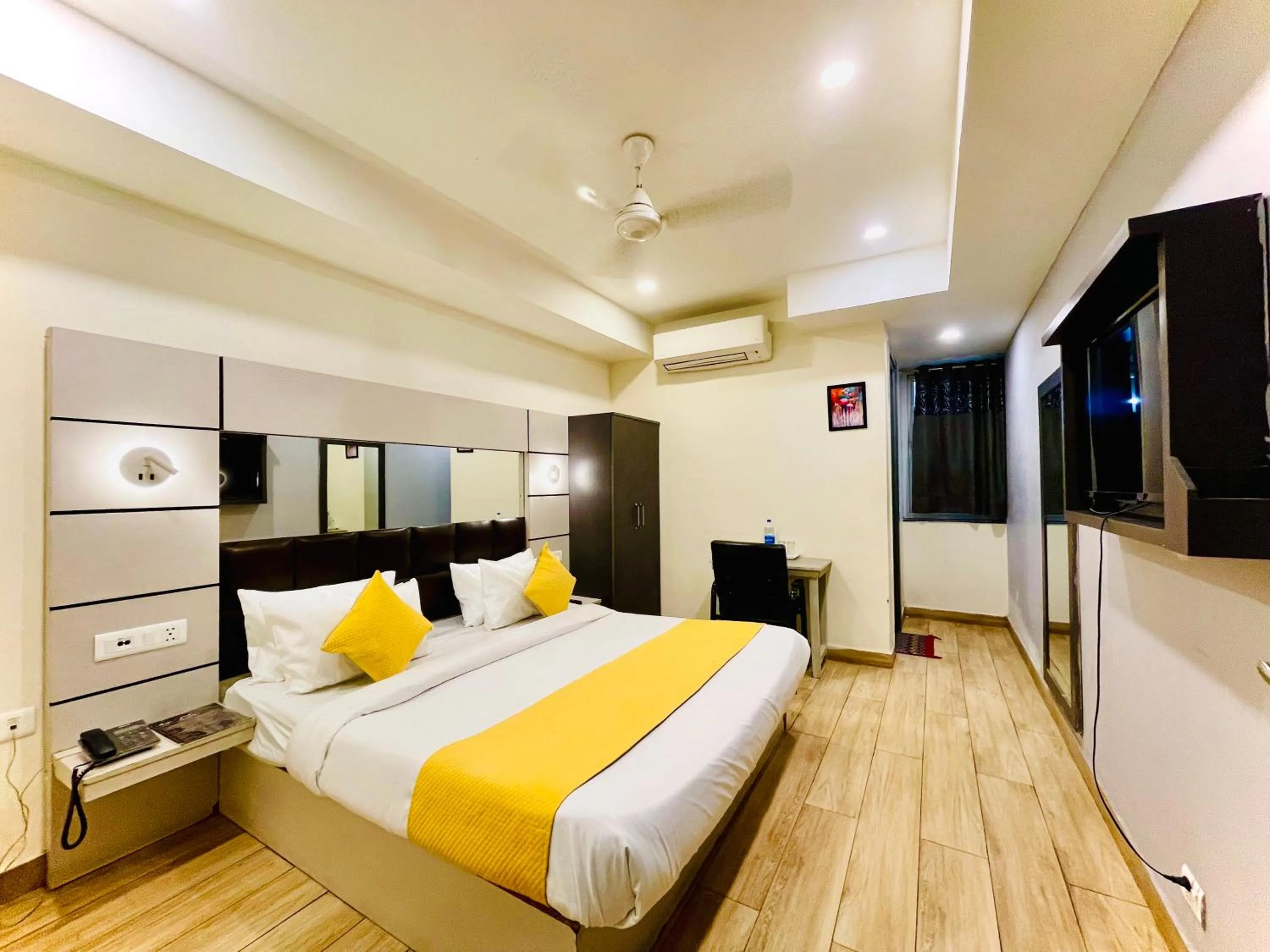 Bed in Hotel Royal Saffron by Majesta Stays