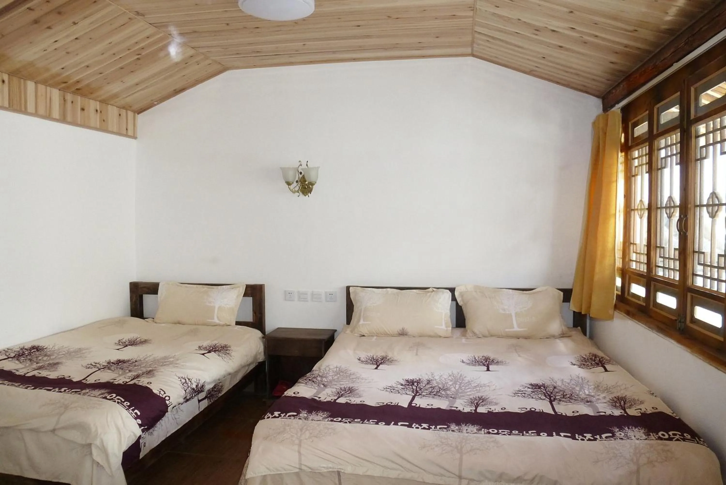 Bed in Tourist Courtyard Hotel