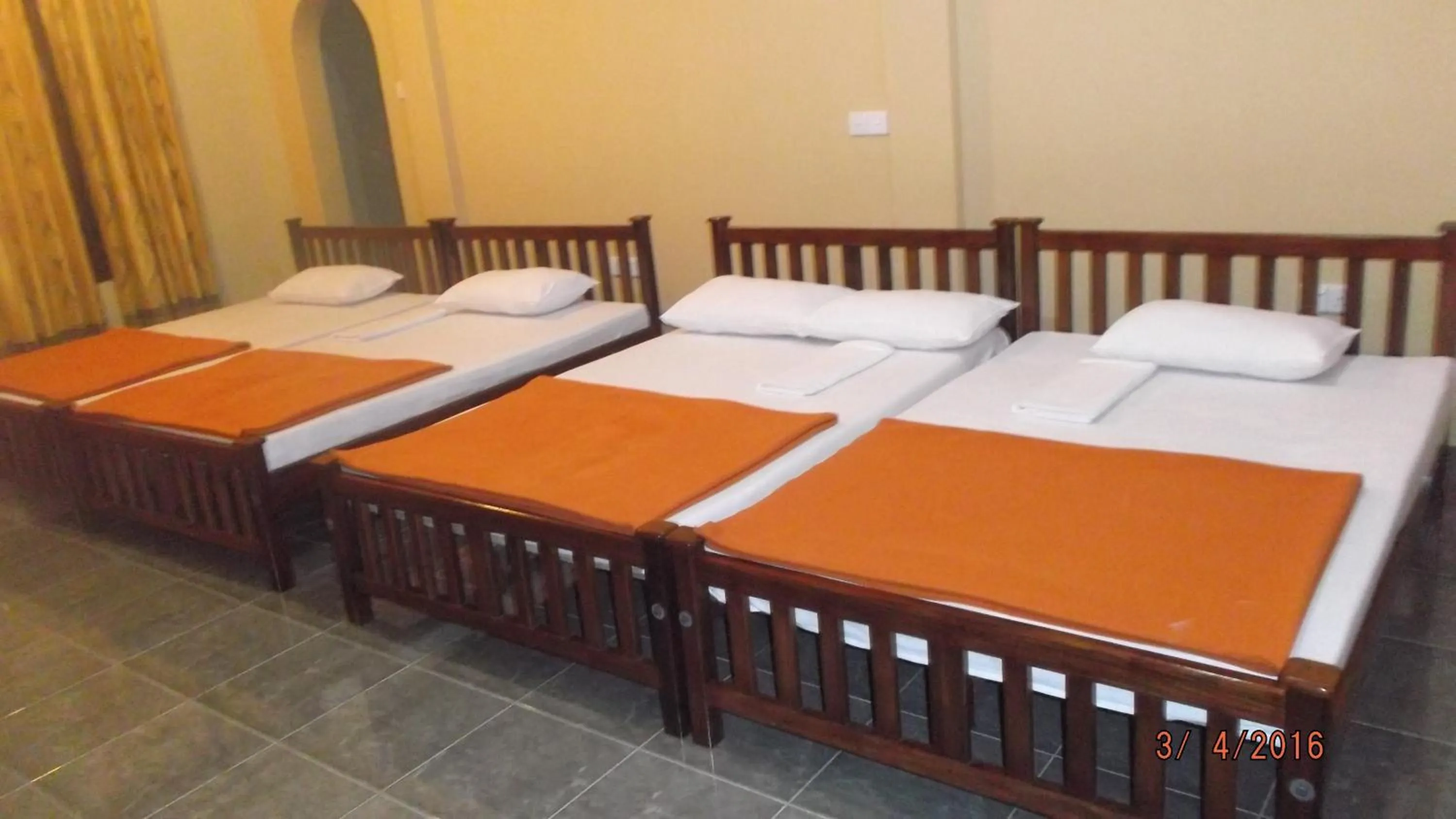 Bed in Anura Guest Inn