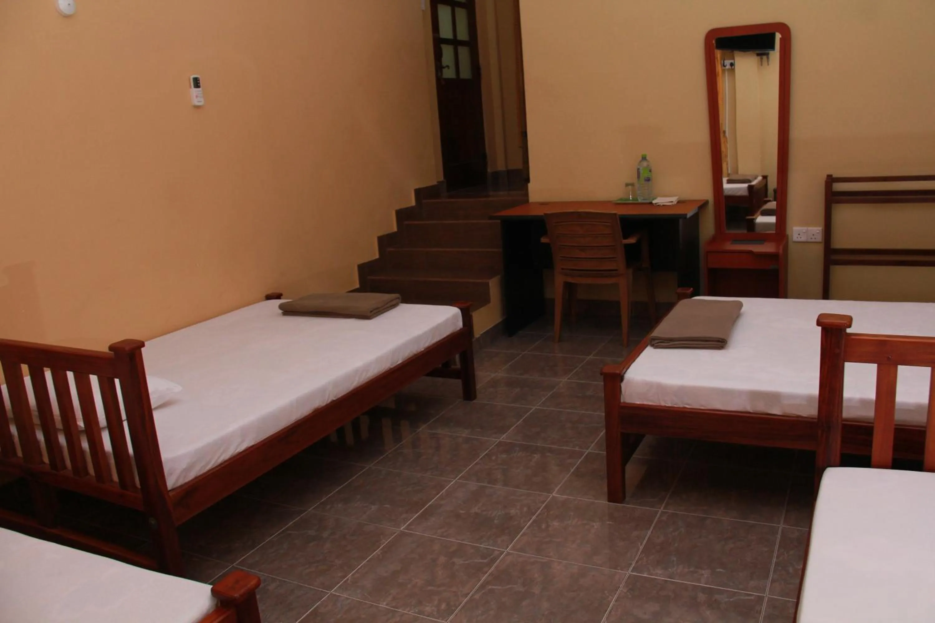 Bed in Anura Guest Inn