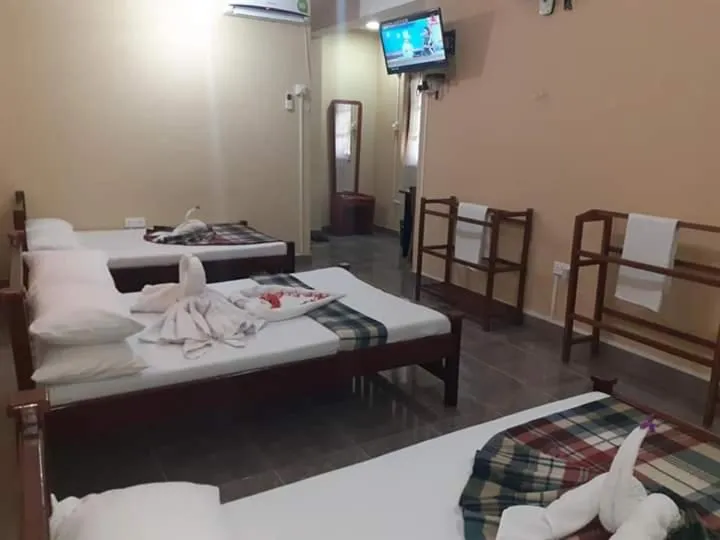 Bed in Anura Guest Inn