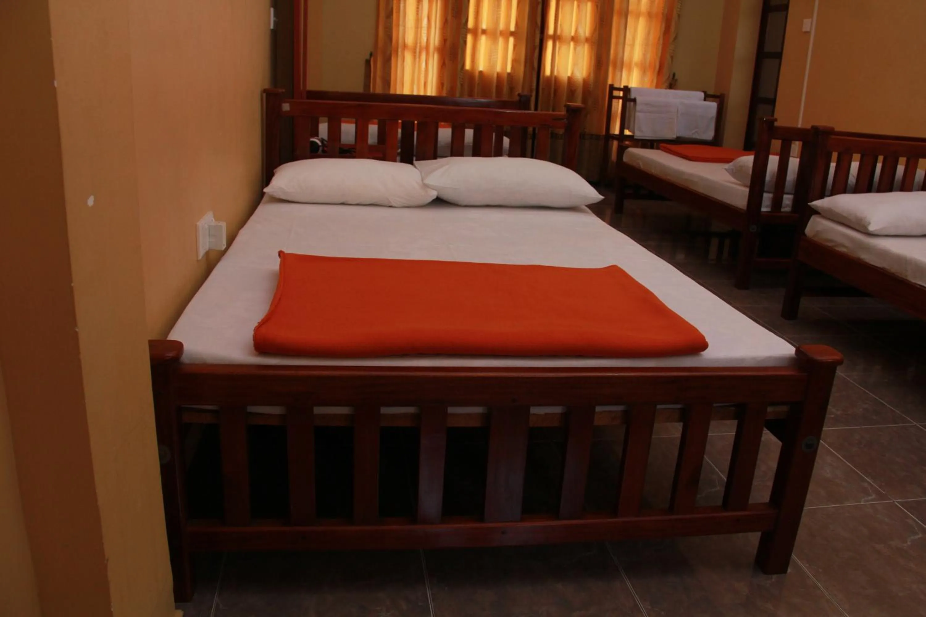 Bed in Anura Guest Inn