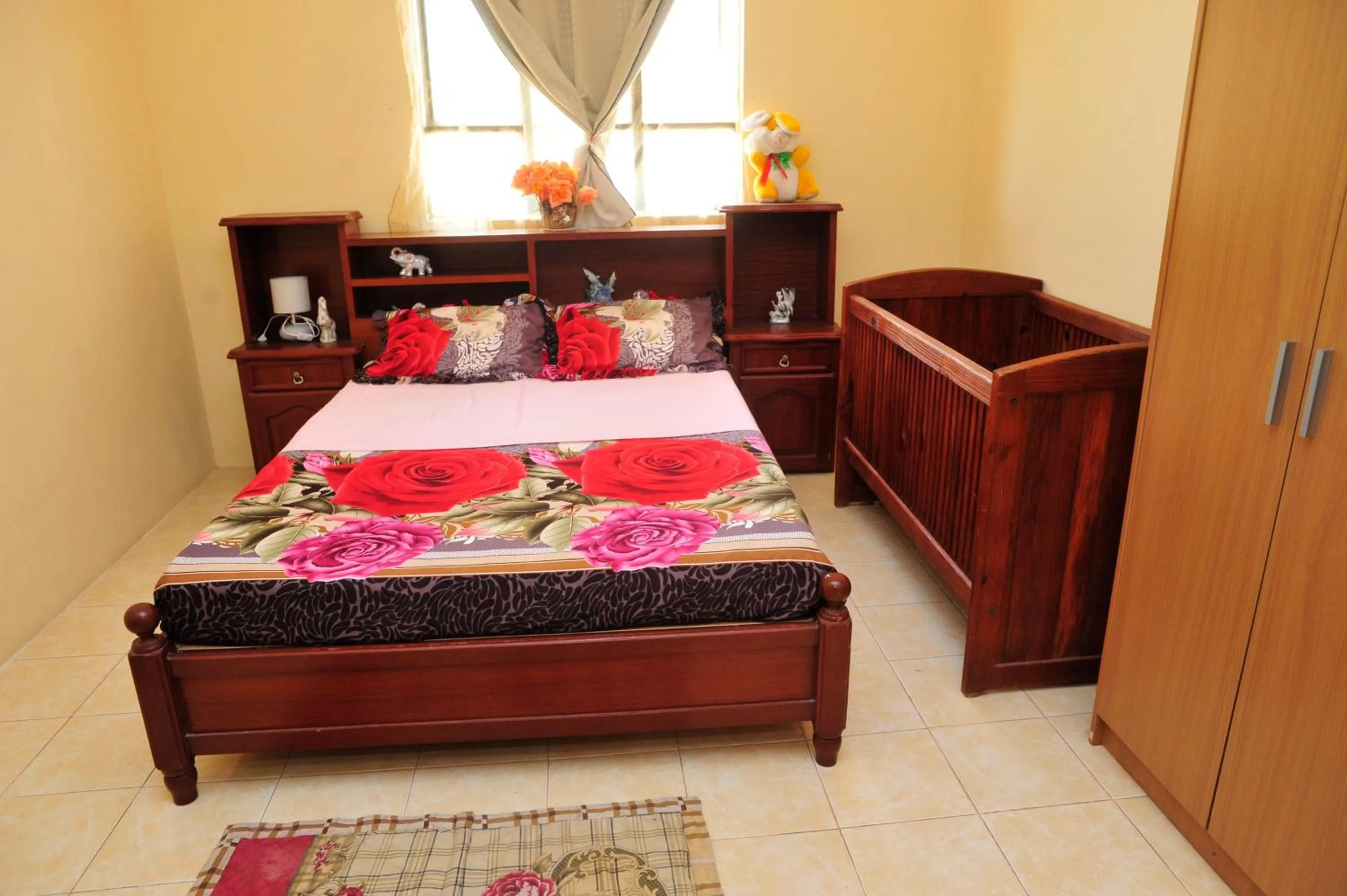 Bed in Chez Ronald Guest House