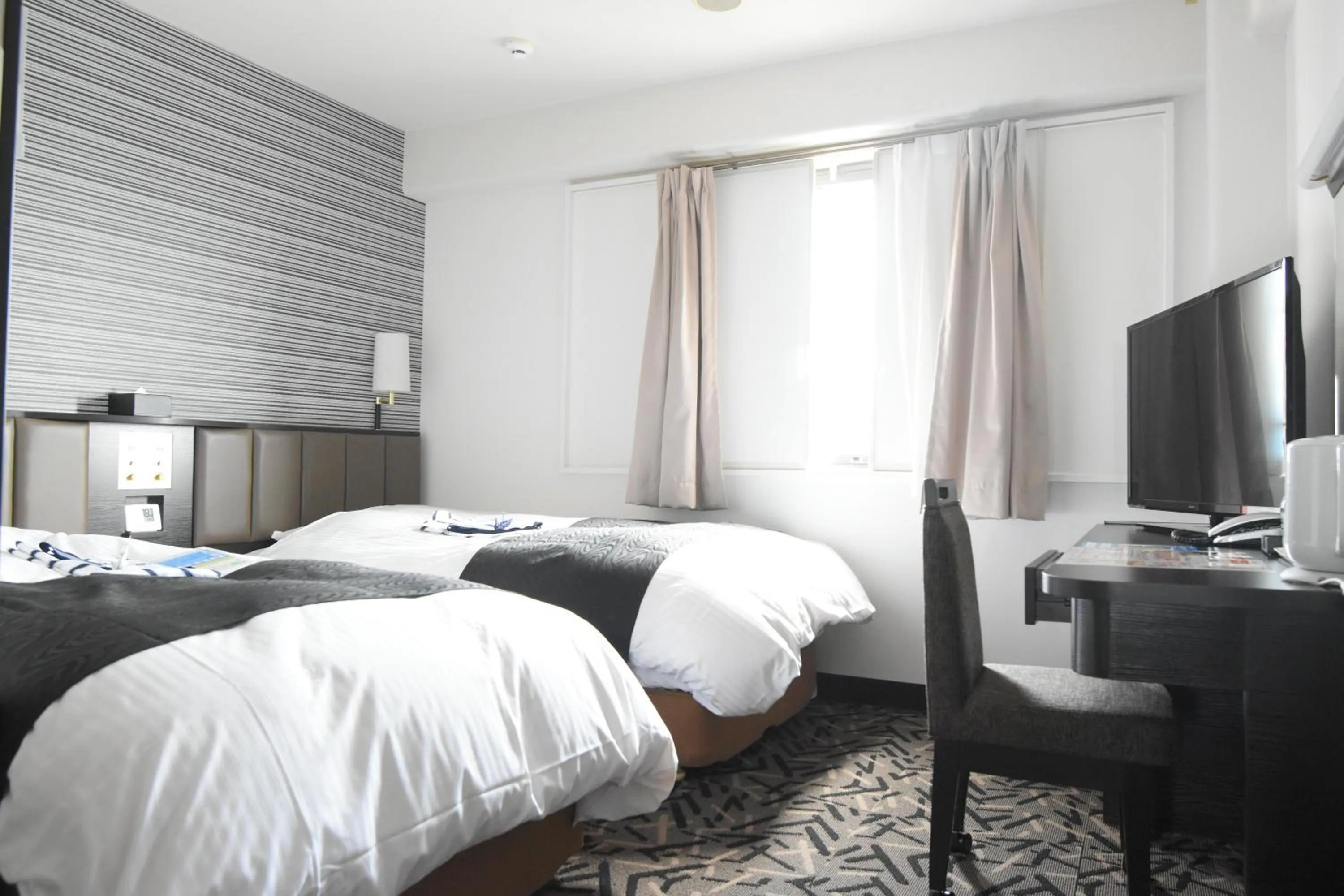 Bed in APA Hotel Miyazaki Miyakonojo Ekimae