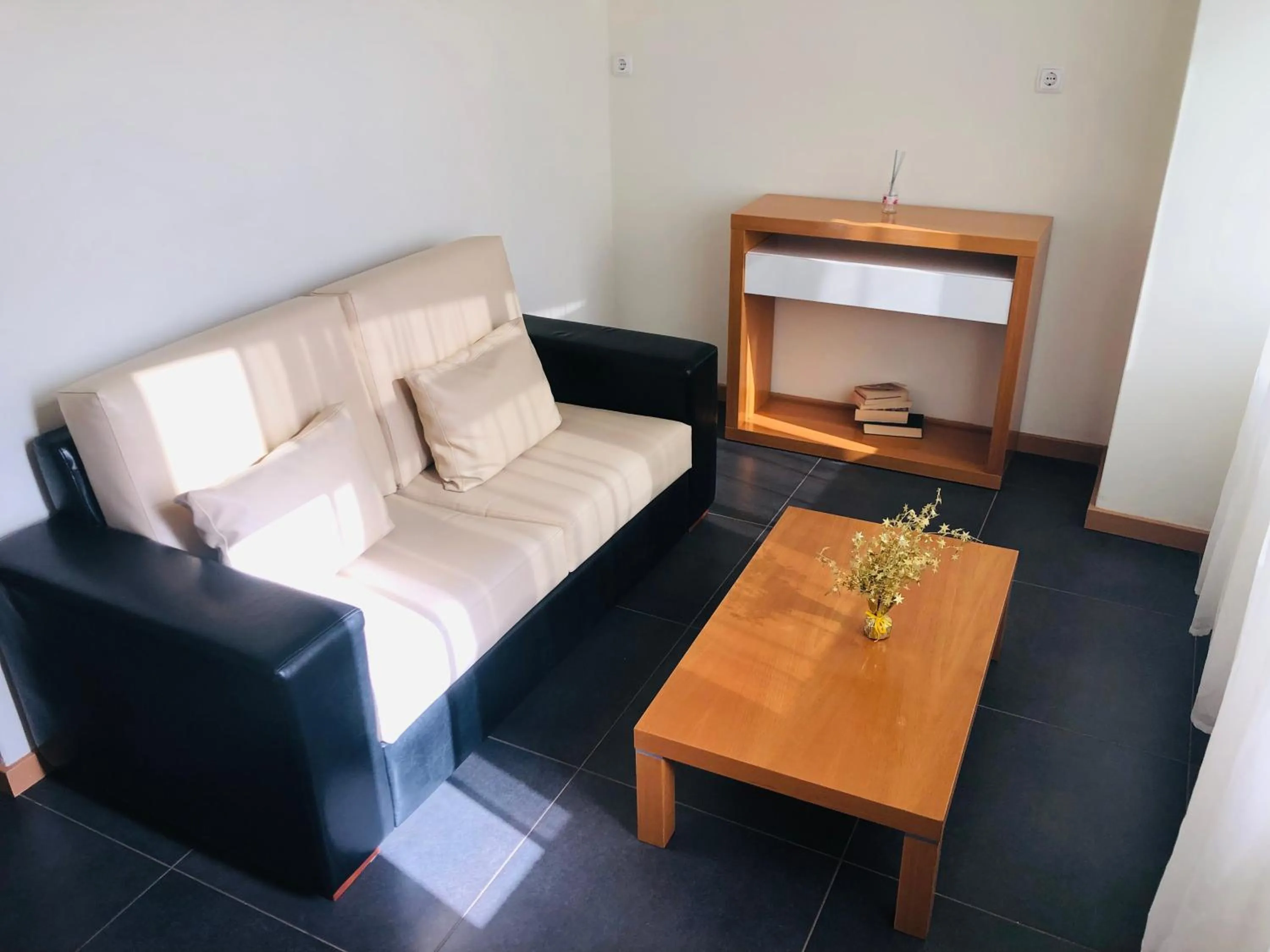 Seating area, Bed in Vivi Hotel