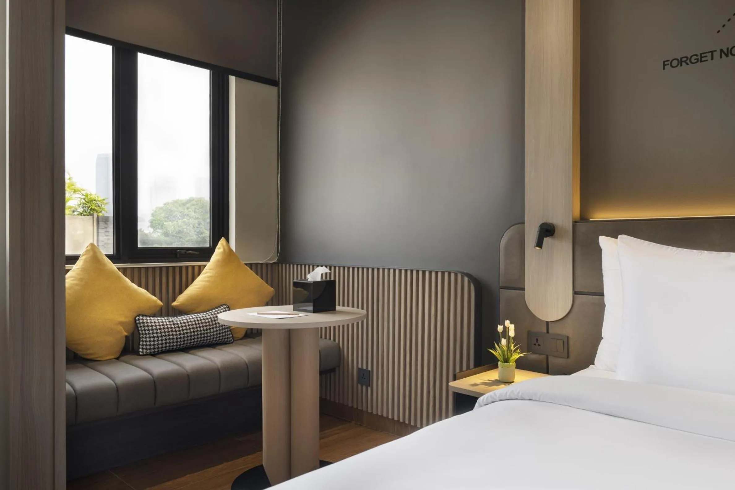 Seating area, Bed in ROOMS INC Sudirman Jakarta