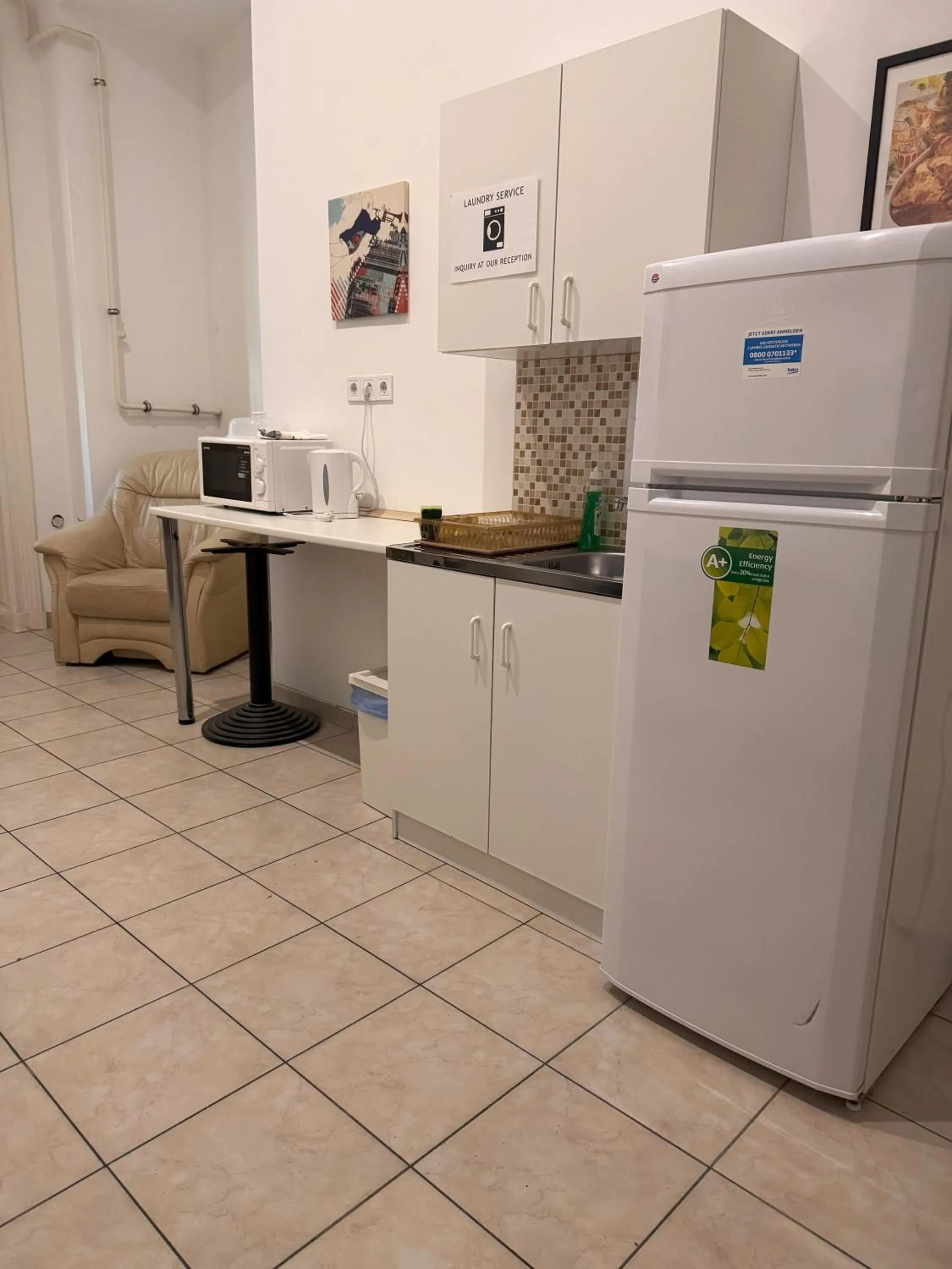 Kitchen or kitchenette in Omega Guesthouse Budapest